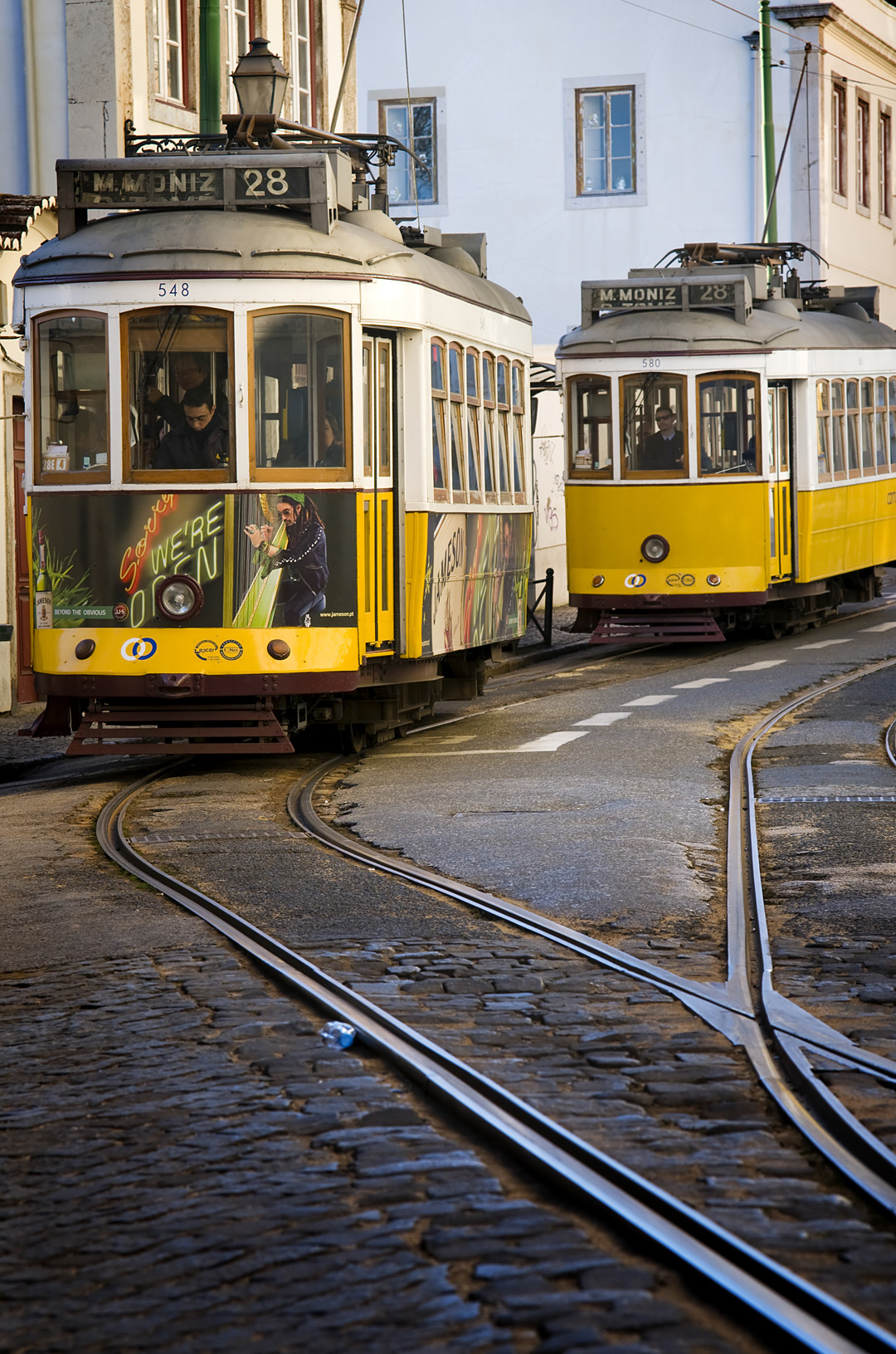 Trams in the streets of the Alfama district of Lisbon. 