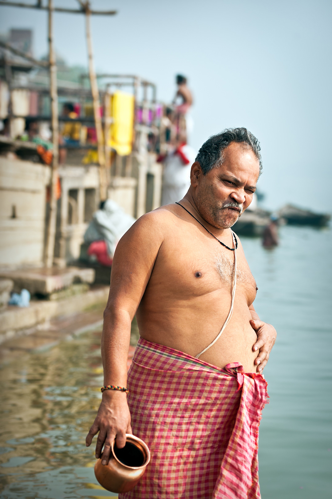 A man having a bath in the ghats, Varanasi. 