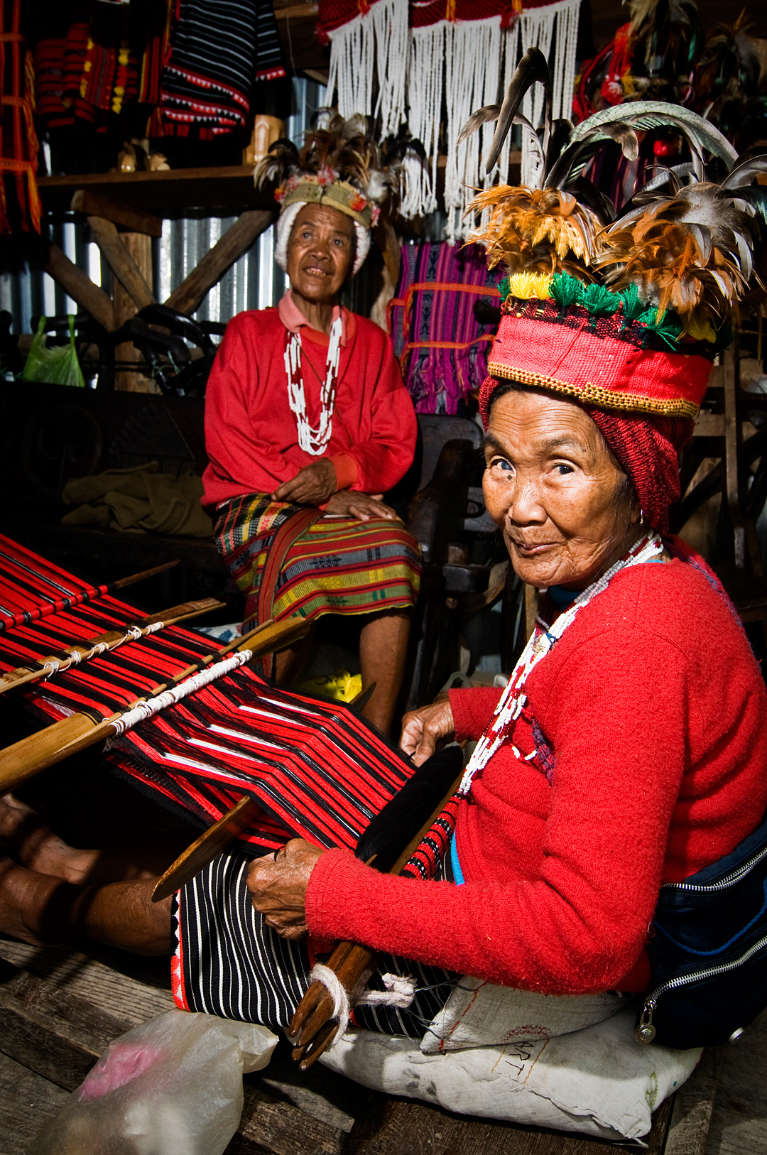Old Ifugao women weaving in a souvenir shop near Banaue. 