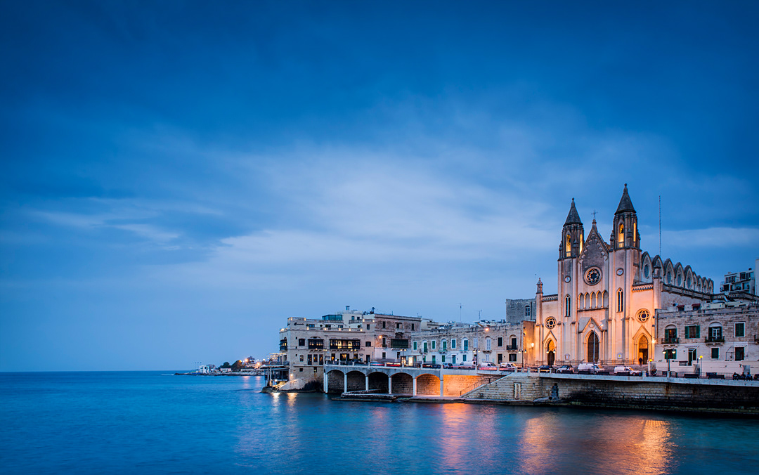 Our Lady of Carmel Parish Church at Balluta Bay, in St. Julian at dusk. 