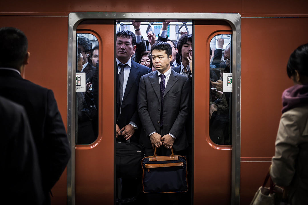 People in a subway car. Shinjuku station, Tokyo.