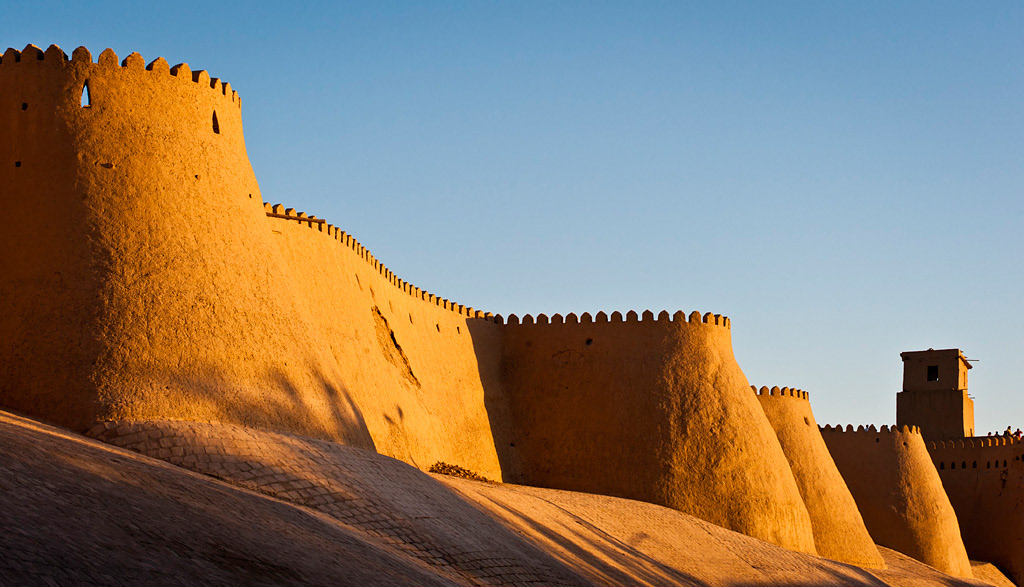   Khiva (Ichon-Qala). Khiva walls and Kunha Ark at sunset. 