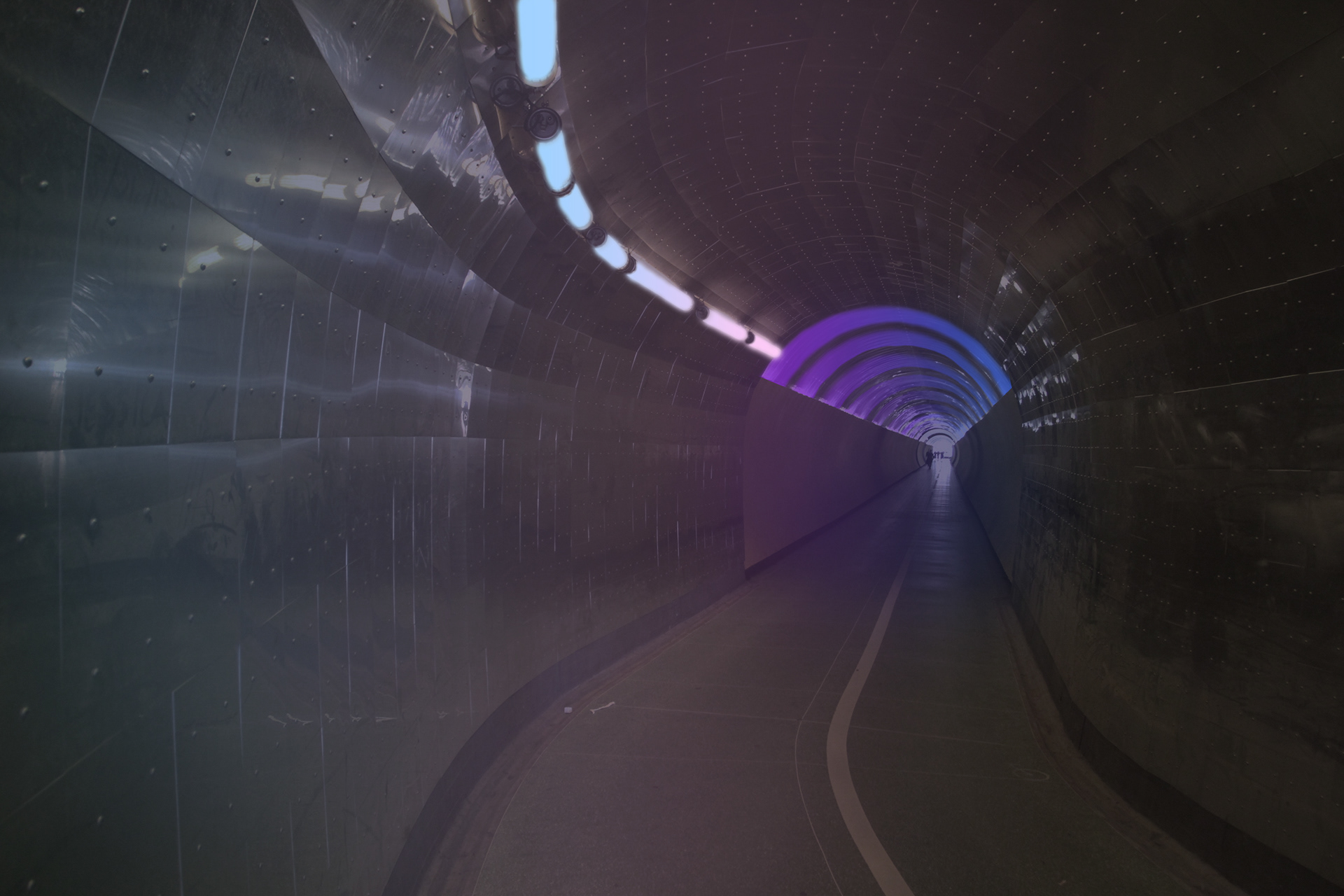 Light installation showing the cool auras split into two parts of the tunnel, the first one a sunrise aura and the second a sunset aura; using blue pink and purple lights.