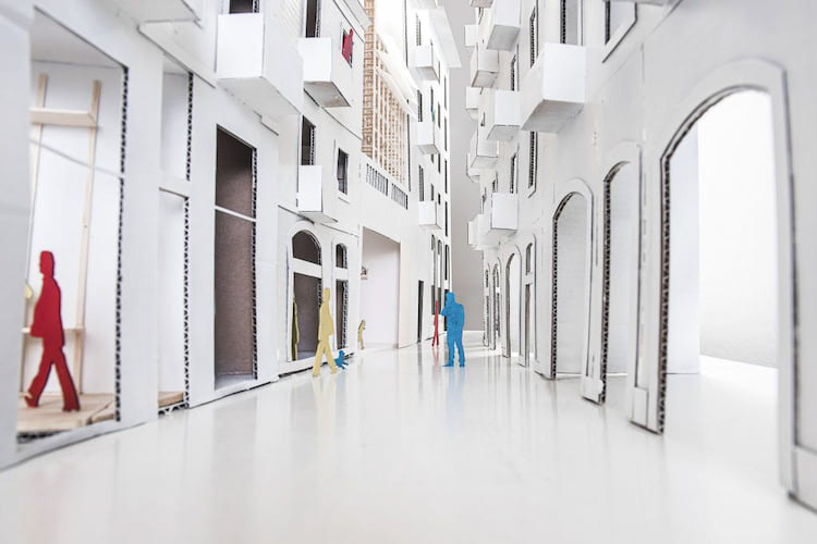 Ground view perspective of the physical model facing a model of a neighboring building.