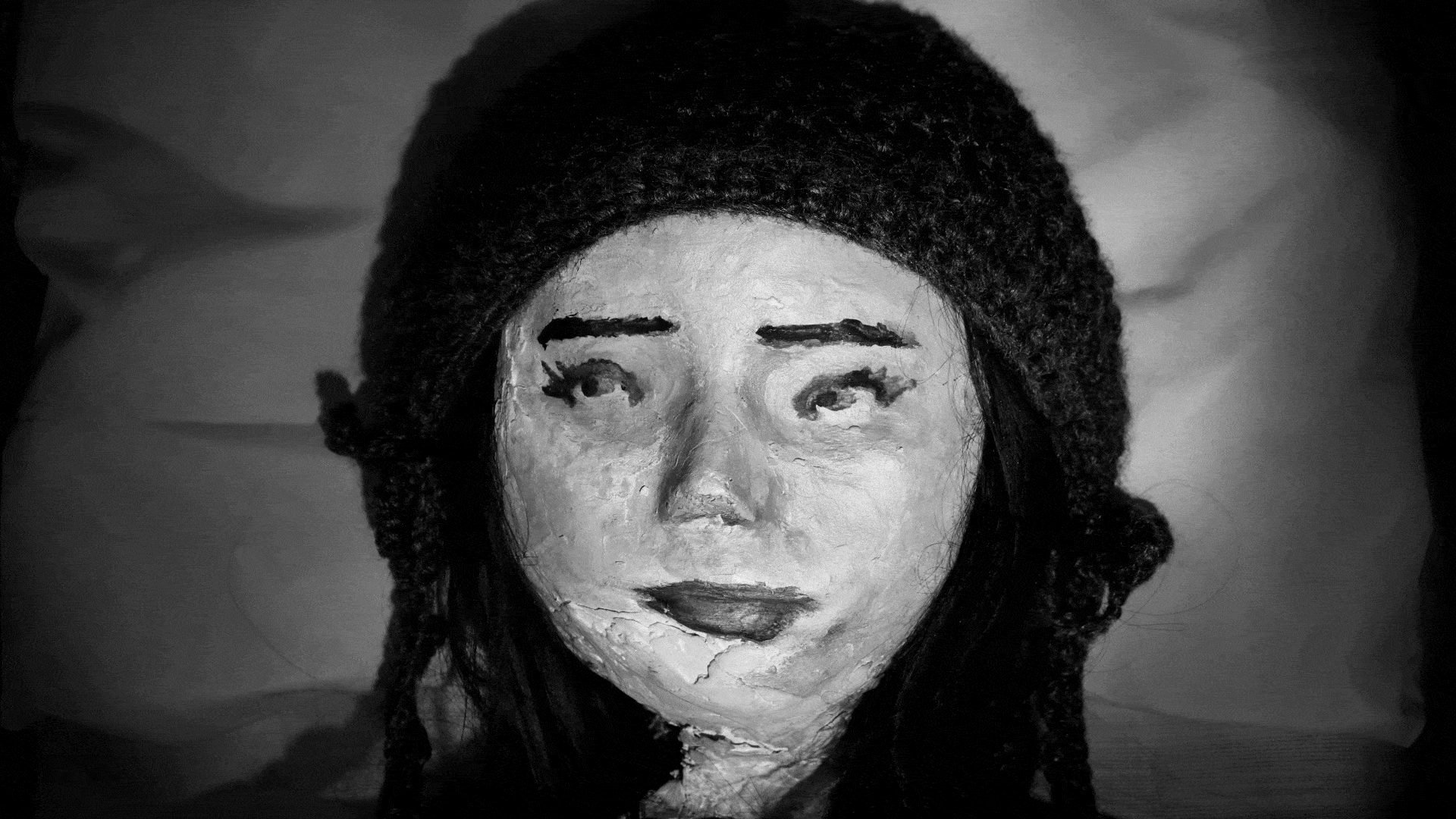 La Niña, a lifesize doll with a plaster face.