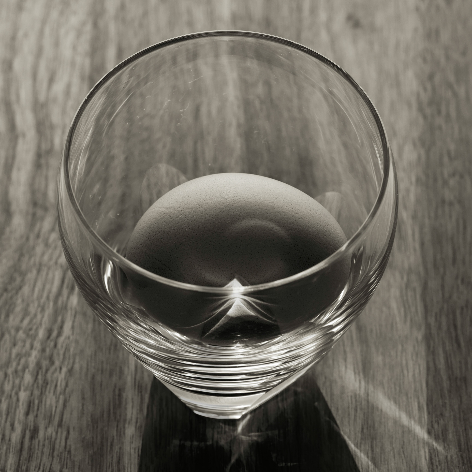 Egg in Glass and Direct Sunlight (composite of two images)