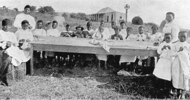 Mrs Mdima Dube and her early years needlework class.