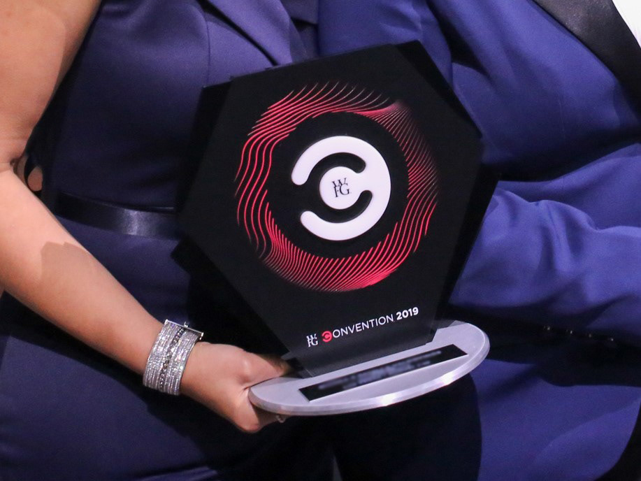 Trophy held by Award Recipient