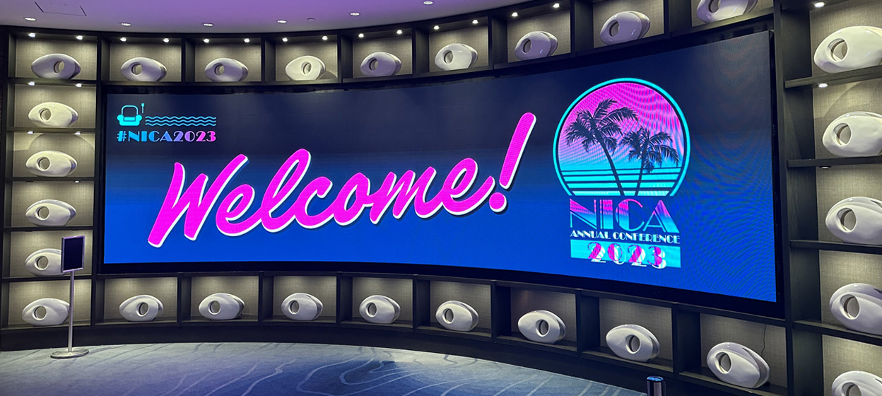 Custom event branding and environmental graphics by LMI+D for the 2023 NICA Annual Conference, including print and digital elements.