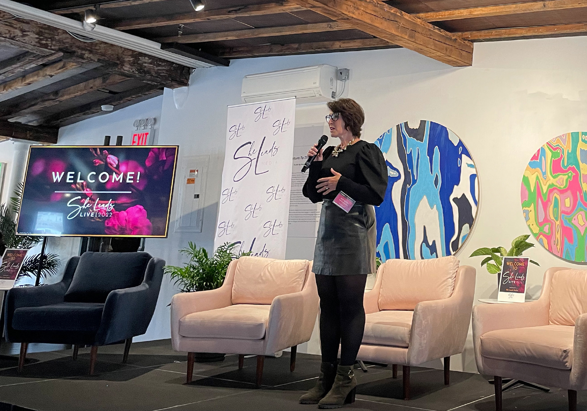Adrienne Garland, founder of SheLeads Media and host of She Leads LIVE 2022, smiling at the event