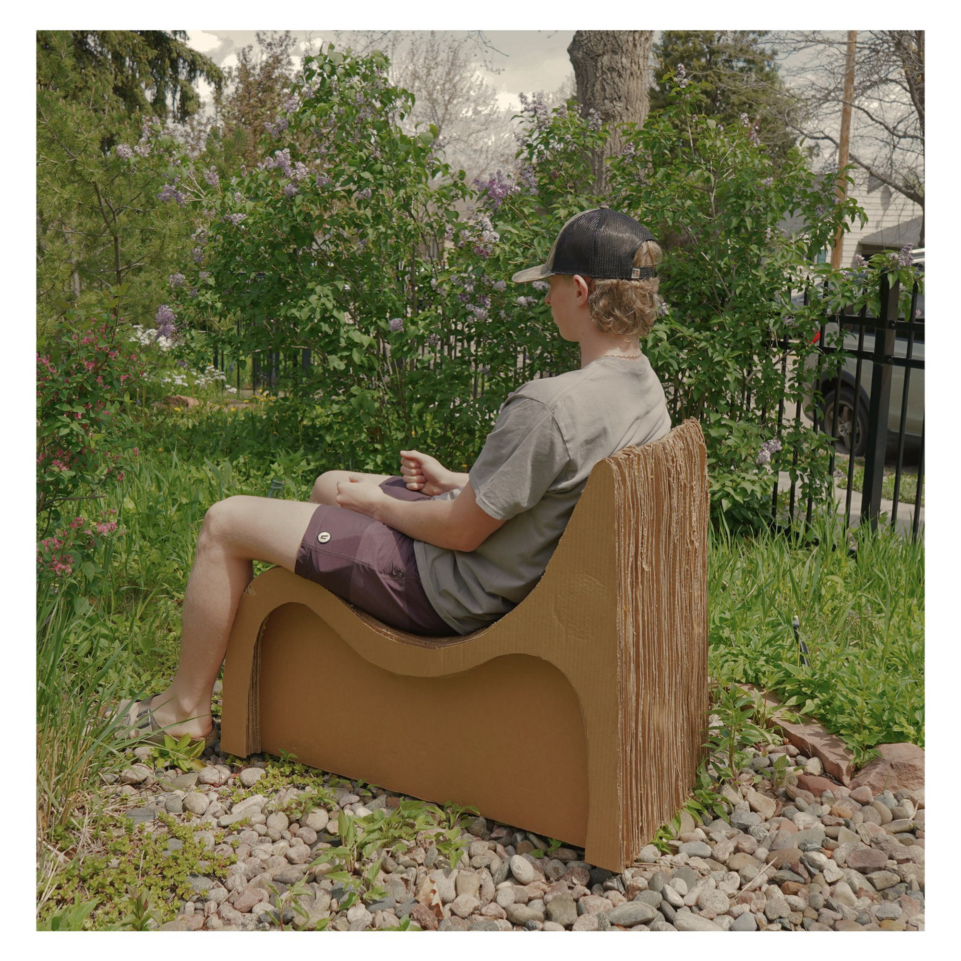 A minimalist two-seat chair designed around comfort, ergonomics, and form. Layered cardboard, soft curves, and integrated backrests support both upright and relaxed seating.