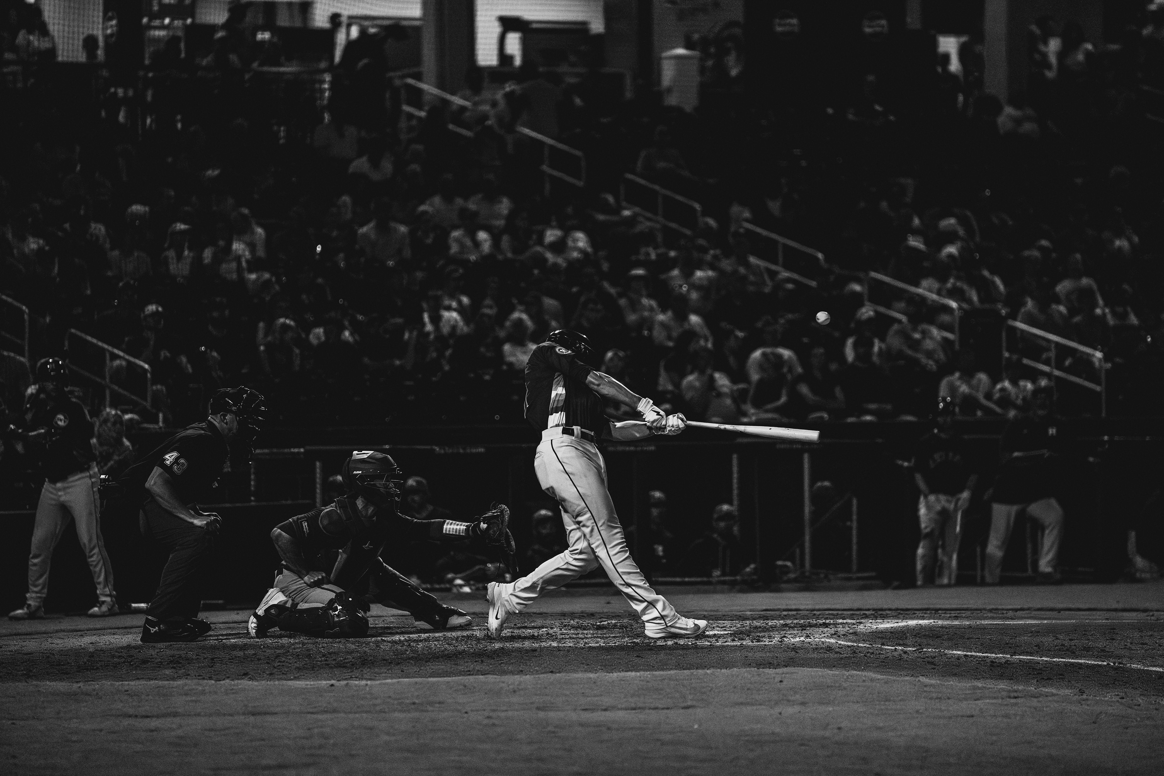 Houston Astros batter mid-swing with the ball off the bat during a spring training game against the New York Mets at The Ballpark of the Palm Beaches, March 2026. Black and white edit. Photo by Aday's Media Production
