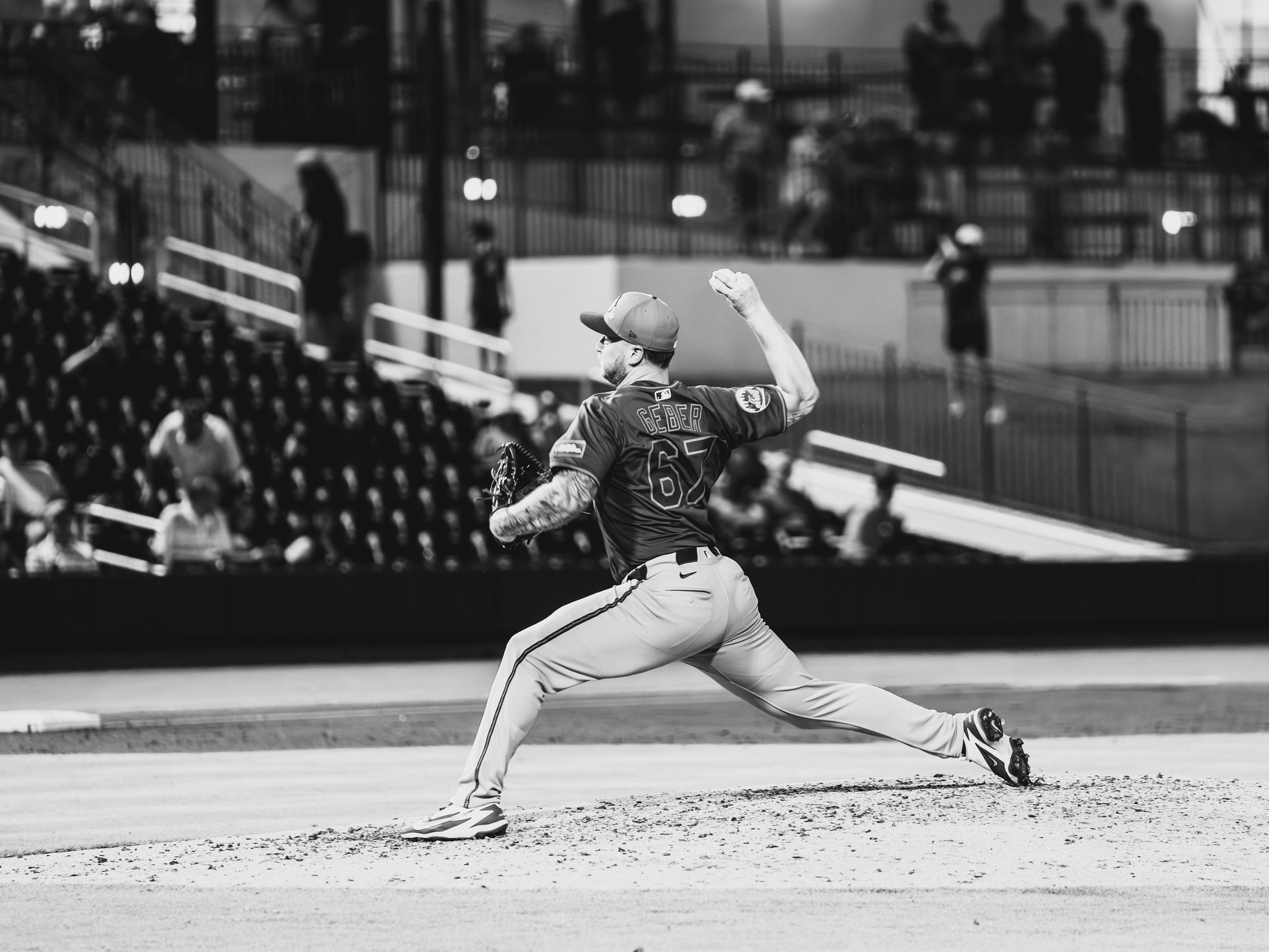 New York Mets pitcher Jordan Geber (67) delivers a pitch during a spring training game against the Houston Astros at The Ballpark of the Palm Beaches, March 2026. Black and white edit. Photo by Aday's Media Production