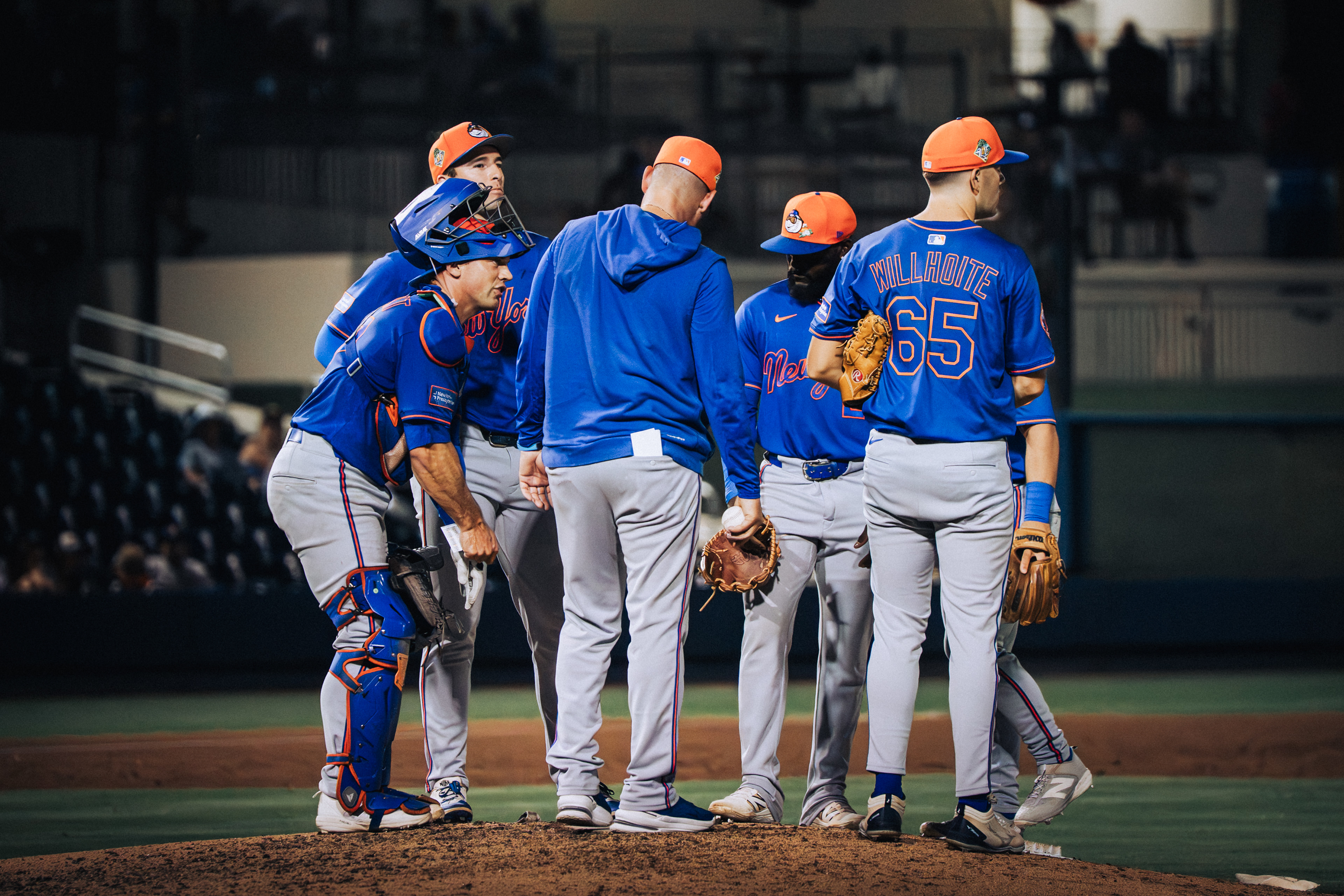 New York Mets mound visit with coaches and Trace Willhoite (65) during a spring training game against the Houston Astros at The Ballpark of the Palm Beaches, March 2026. Photo by Aday's Media Production