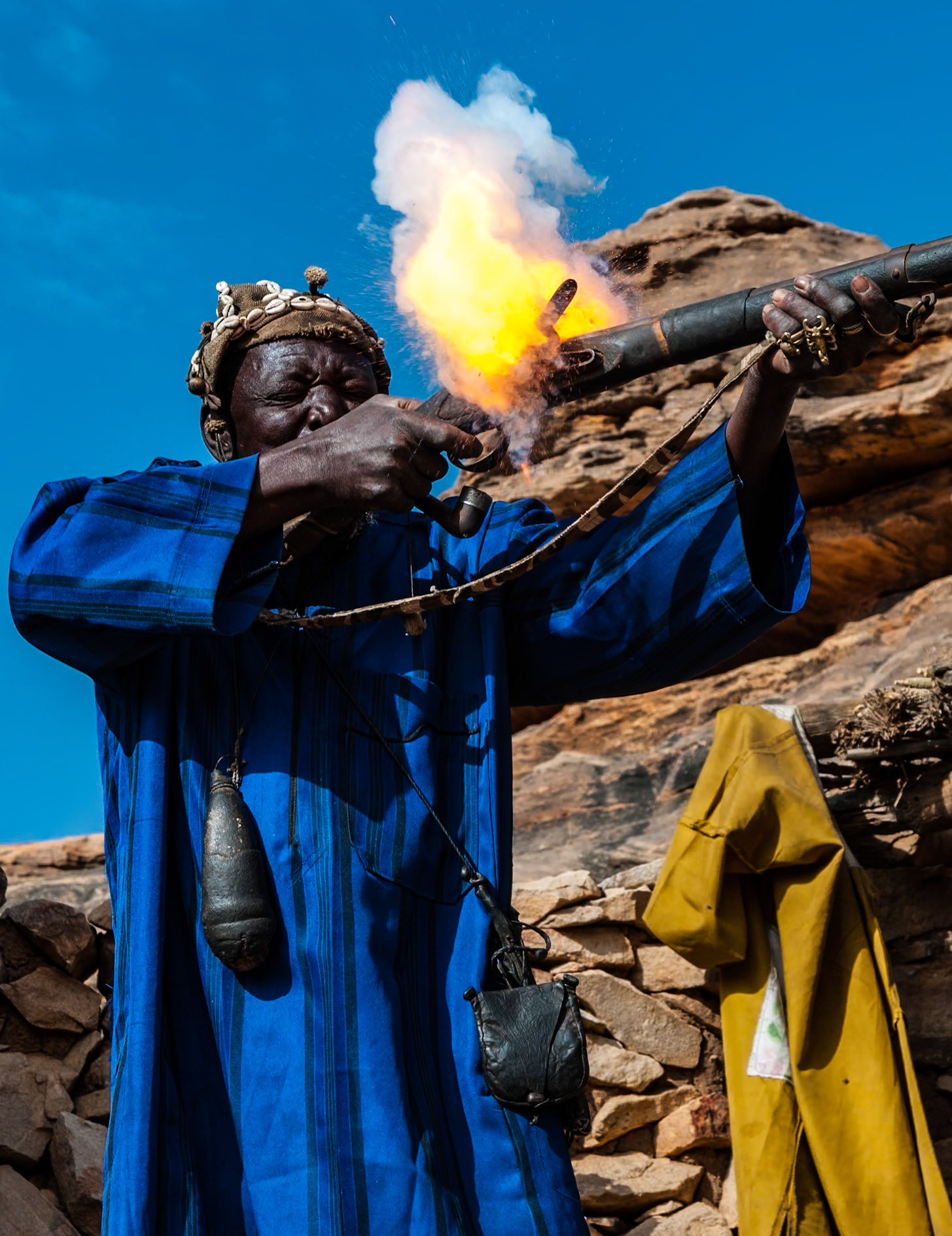 A hunter from Mali's Dogon Country gives a more dramatic demonstation of his flintlock rifle than intended. Perhaps it was the vast quantity of alcoholic palm wine we had been sharing, causing an overzealous load from the leather powder flask.