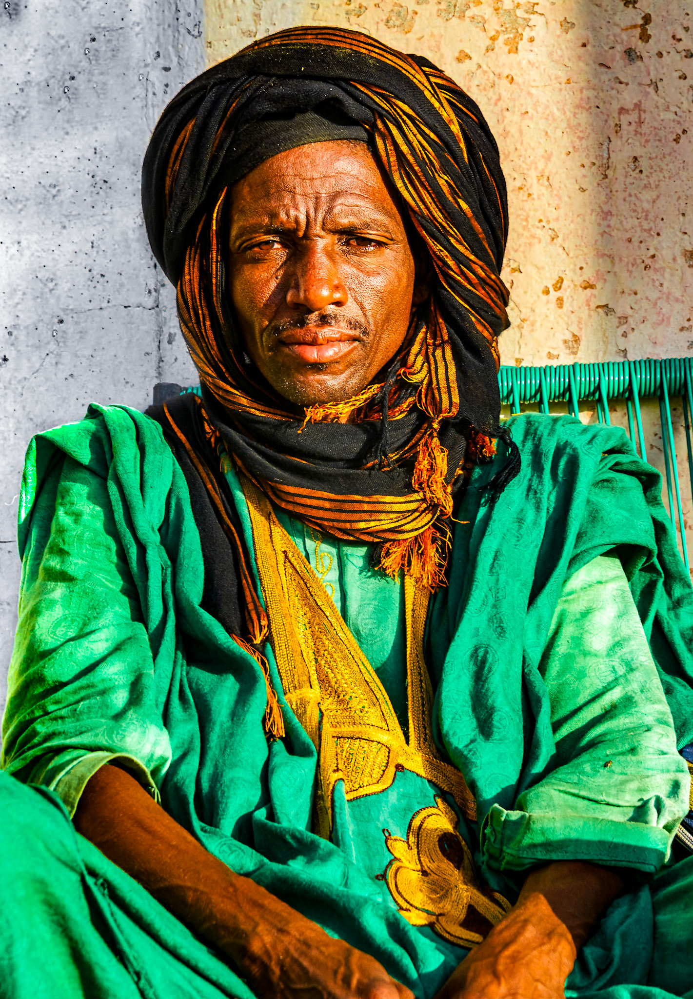 Tuaregs wearing cheches and green tagelmust, sometimes referred to as "Black Moors", are a group of closely-related North African peoples. They are native to the northwestern regions of the Sahara, especially in the Maghreb. This man and I spent a relaxing afternoon drinking mint tea and sharing watermelon outside our hotel on Mali's border in Nioro du Sahel.