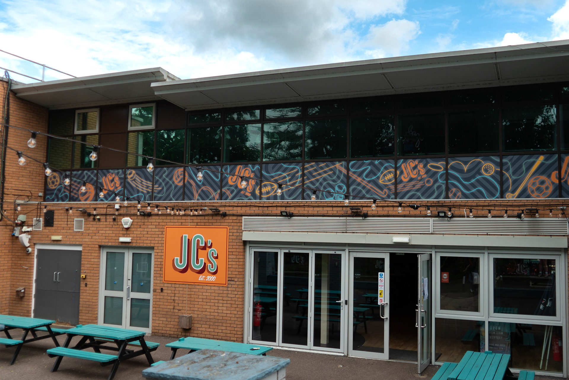 Large scale window vinyl outside of student sports bar - 50x3ft