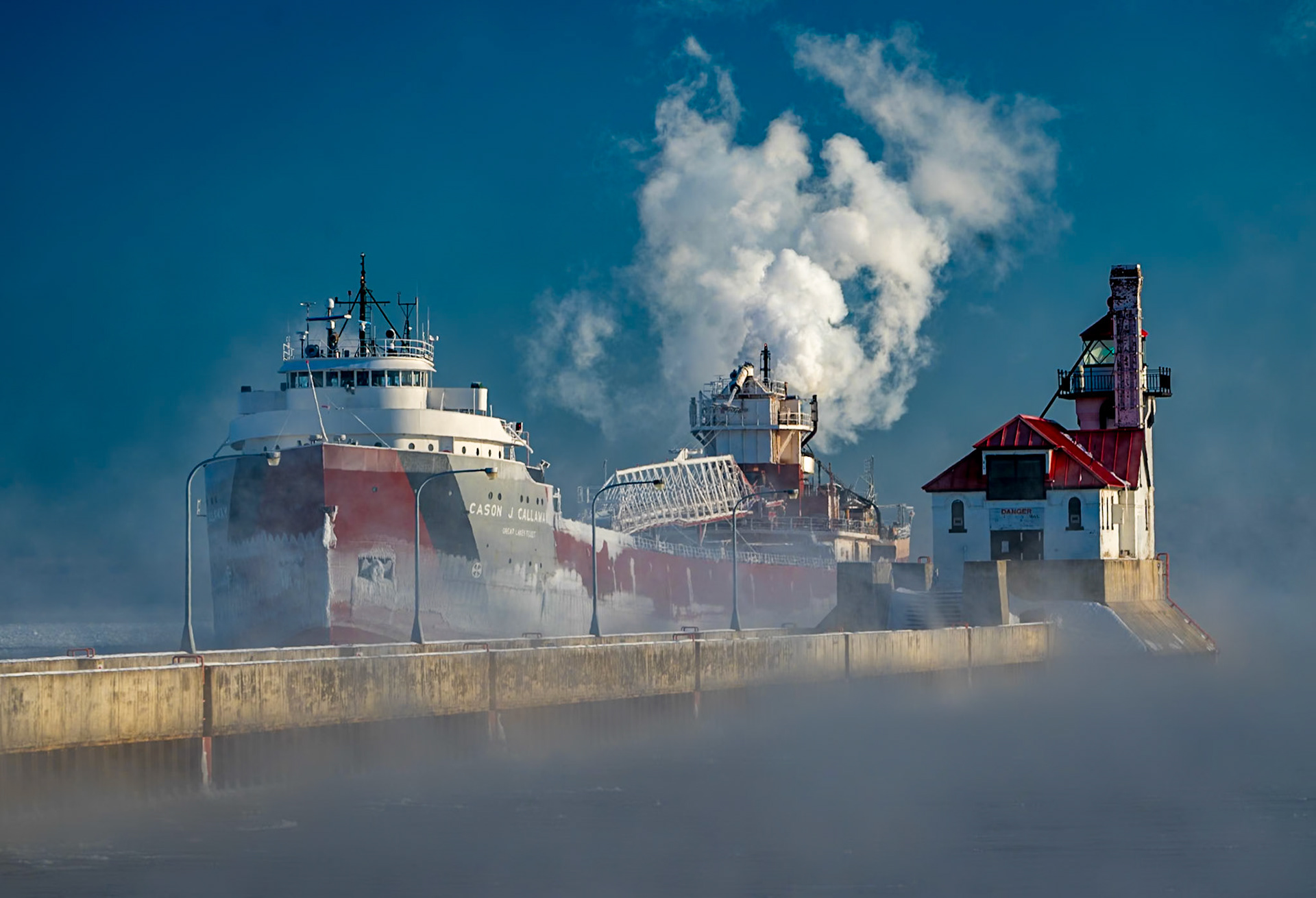 January 3 - Deep Winter ShippingThe Cason J Callaway arrived in Duluth, passing through sea smoke boiling off Lake Superior's open water. Within a few weeks, this area will be thick ice until Spring.Shipping on Lake Superior continues into mid-January with severe cold and thick ice. However, in these icy conditions of -20F, you can also see incredible beauty everywhere you look. The coldest temperature recorded in Duluth was -41, which occurred on January 2, 1885. Emersed in the cold of January, Springtime seems far off; however, the daylight hours are already stretching longer, and soon, it will be noticeably lighter at supper time."From the breath of God ice is made,And the expanse of the waters is frozen." Job 37:10Sometimes hope is surrounding us, and we miss it because of our situation, but Spring is right around the corner, just like January. And indeed, as Spring follows Winter, as Christians, the hope we find in Christ is always there; we only have to look up.
