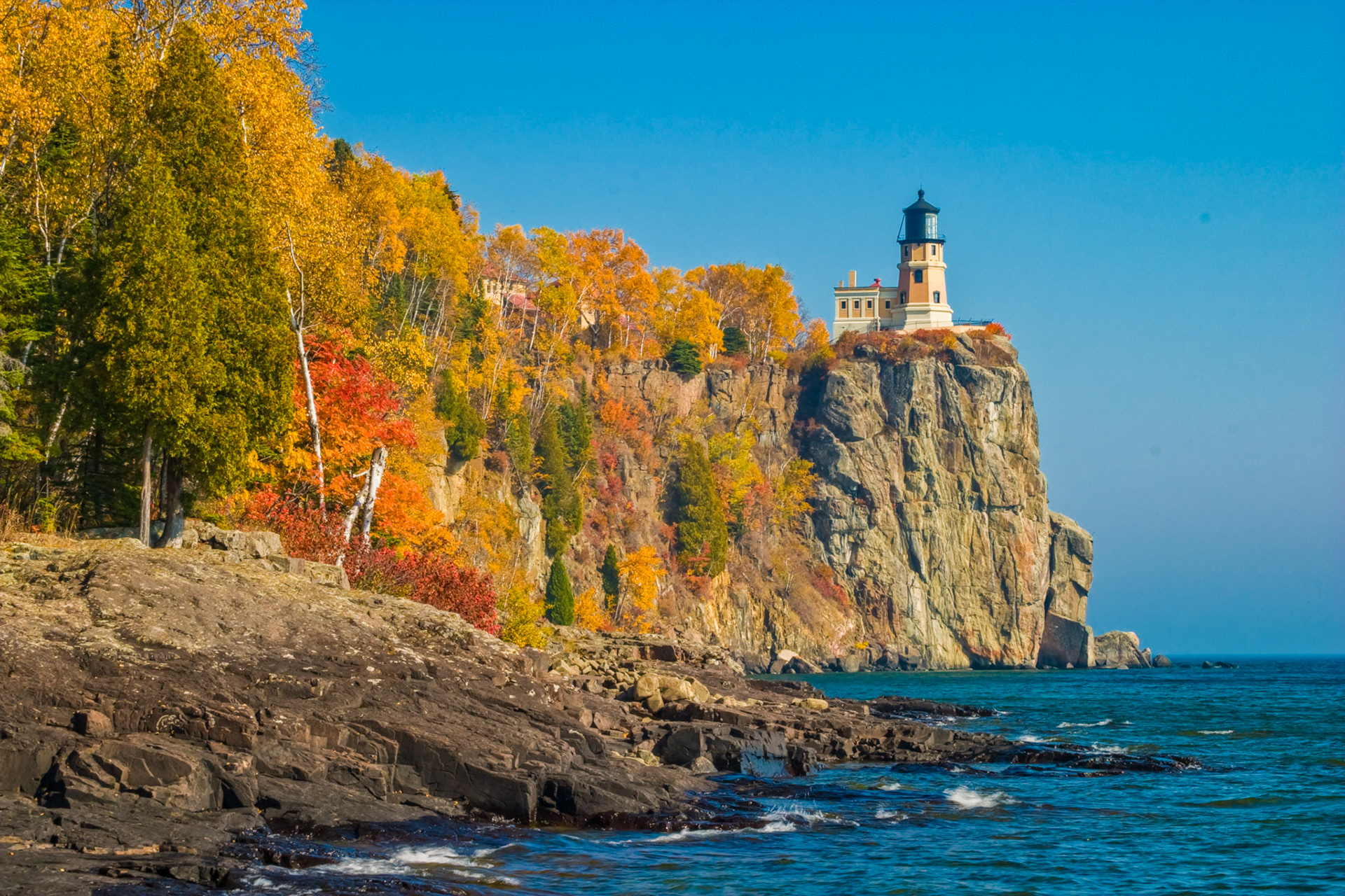 October 10 - Autumn Colors at Split Rock   With the second week of October arriving in the Northland, the brilliant colors of autumn have now descended the North Shore slopes to embrace Lake Superior's shoreline. The gold of the aspen, greens of the cedars, and red maple trees embrace Split Rock Lighthouse like a warm blanket and highlight the beauty of this setting.O Lord, our Lord, how majestic is your name in all the earth! You have set your glory above the heavens. Psalm 8:1