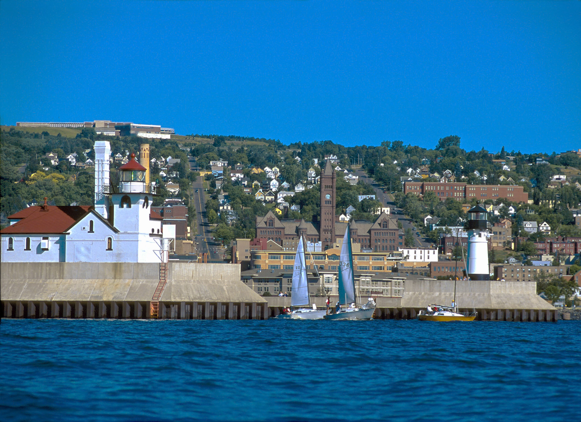 Sailboats leave the Duluth harbor for an enjoyable morning of sailing on Lake Superior.