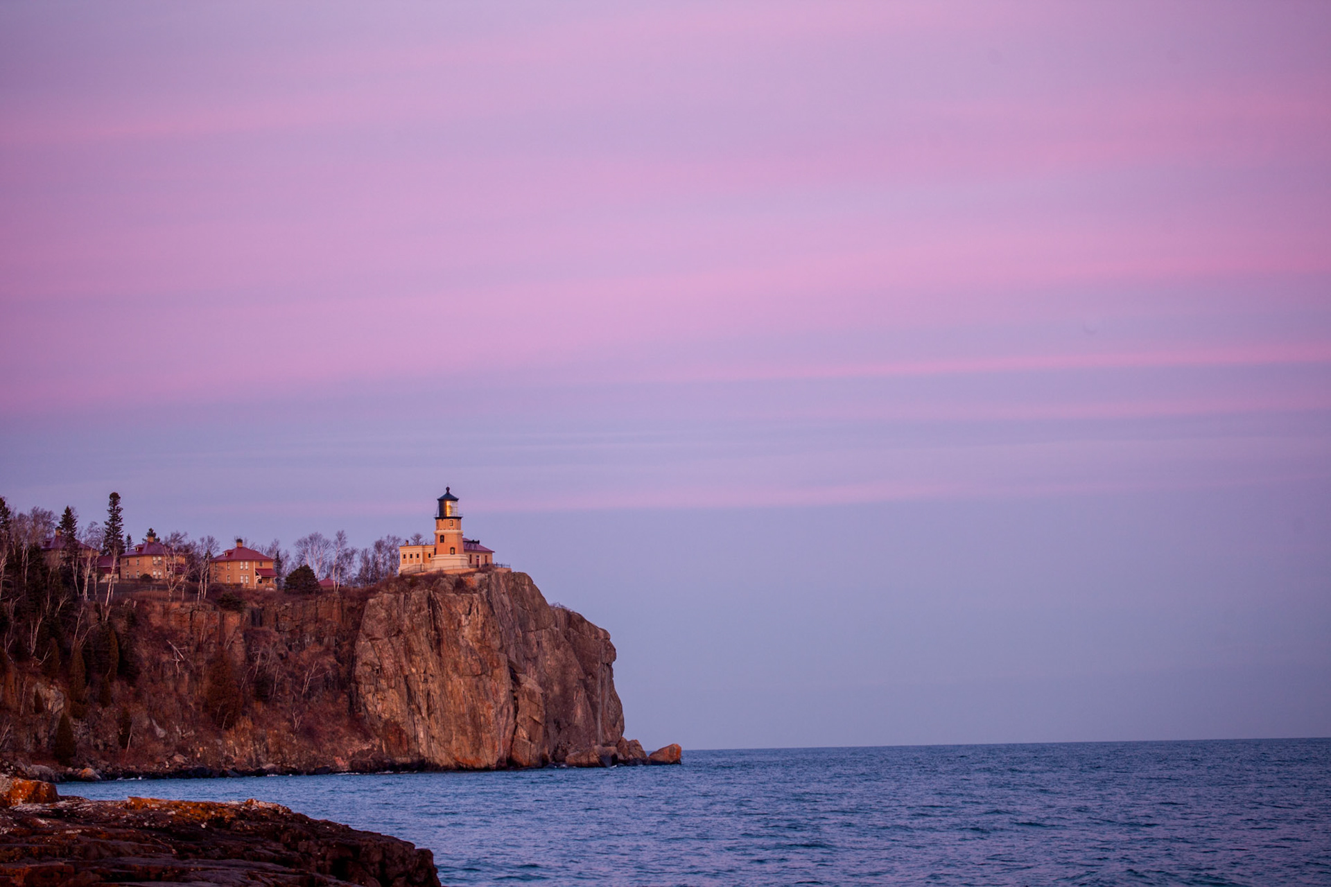 November 11 - Pastel Skies - Split Rock LighthouseThe setting sun at Split Rock is a tranquil sight. Its vibrant colors and the quiet calm that follows create a peaceful atmosphere, overwhelming the soul. As the skies deepen in color, a new scene unfolds in the nighttime skies, inviting us to find peace in the world's beauty. The changing colors, the sound of the lapping waves on the rocky shore, and the whiff of the cedar forest are all natural gifts that combine to bring peace and assurance. They remind us of the mighty God who frames every second of every day and the tranquility that nature can bring to our lives.Psalm 113:3 - "From the rising of the sun unto the going down of the same the Lord's name is to be praised."