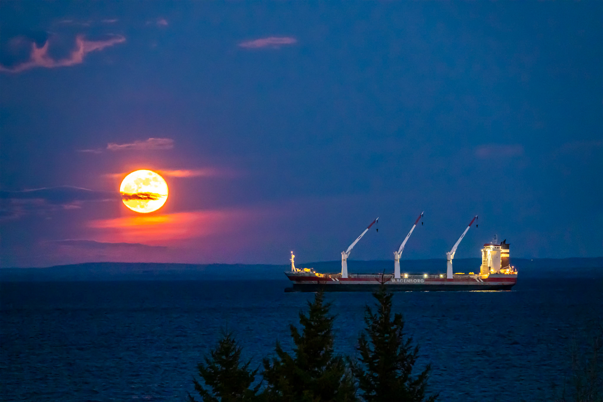 An ocean freighter wailts at anchore outside the Duluth Harbor for it's turn to load grain.