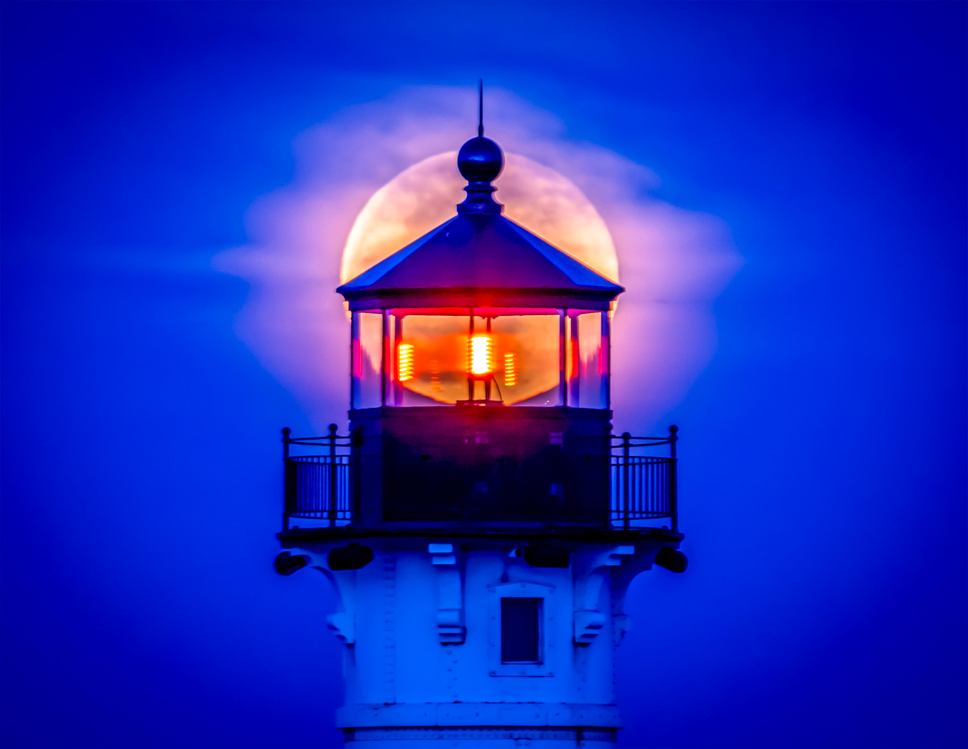 March 10 — Night LightsThe March full moon beamed through the lantern room of the Duluth North Pier Lighthouse when the two aligned perfectly for this photograph.In reality, Earth's rotation creates this alignment. While the moon does move slightly in its orbit, nearly 95% of the apparent motion we see comes from the steady turning of our planet.The Earth completes one full rotation each day and one full orbit each year, creating the rhythm of time and the changing seasons through its motion and tilt. What a magnificent design for life — and a beautiful example of God's glorious provision."He made the moon to mark the seasons; the sun knows its time for setting." — Psalm 104:19It's comforting to know that some things in life remain constant, like the precise clockwork of the universe. Remember that, according to God's perfect plan, each of us has a specific number of days on this Earth before we meet Him face to face. So, look up and observe as the universal clock ticks away. Our days are numbered—make today count, there won't be another like it.
