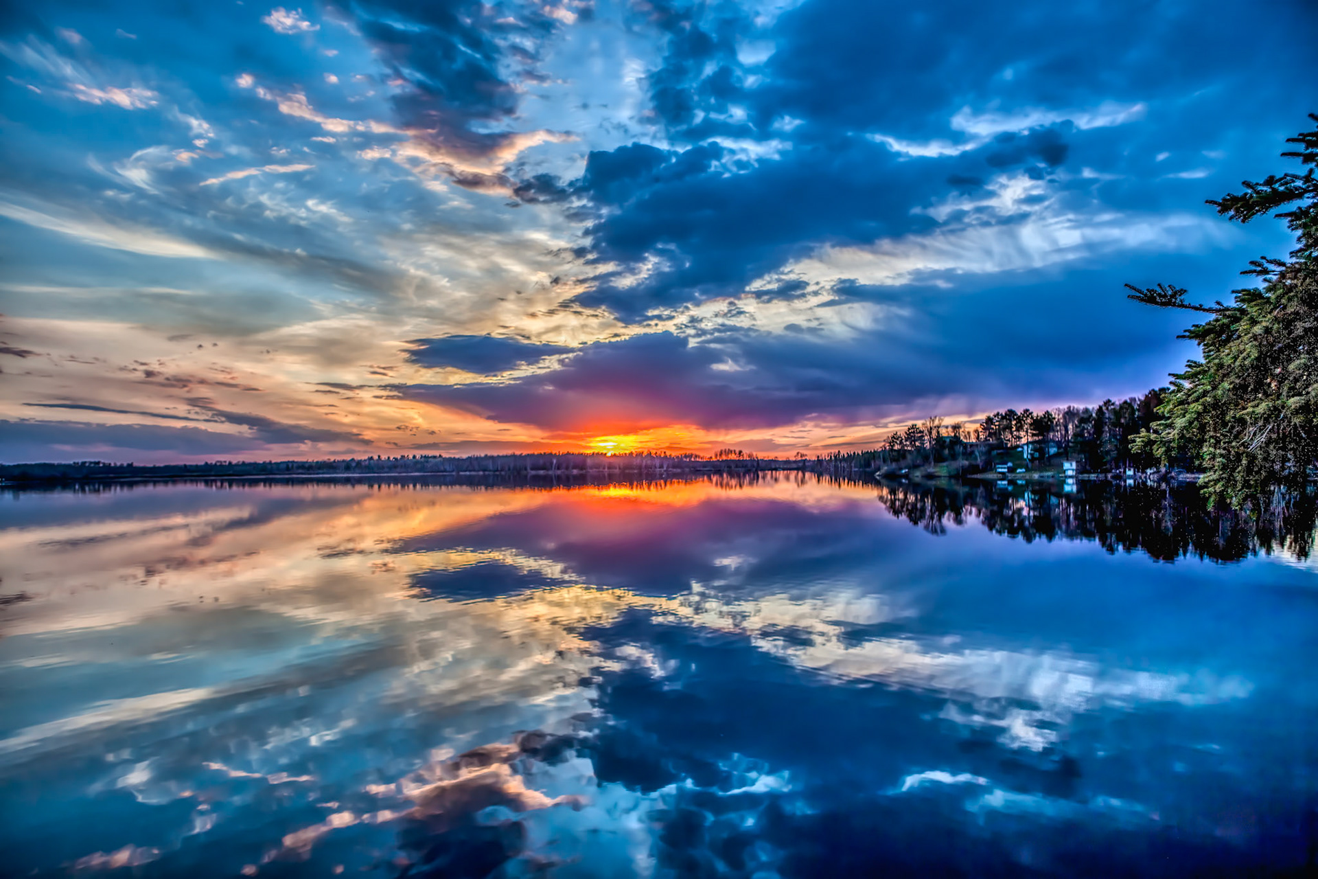 May 15 - Metallic Sky - Caribou Lake SunsetReflections of a mid-May sunset on Caribou Lake doubles the beauty of a quiet and calm twilight.As in water, face reflects face, so the man's heart reflects the man.  Proverbs 27:19As the eyelids close on another day, reflect and enjoy fond memories.