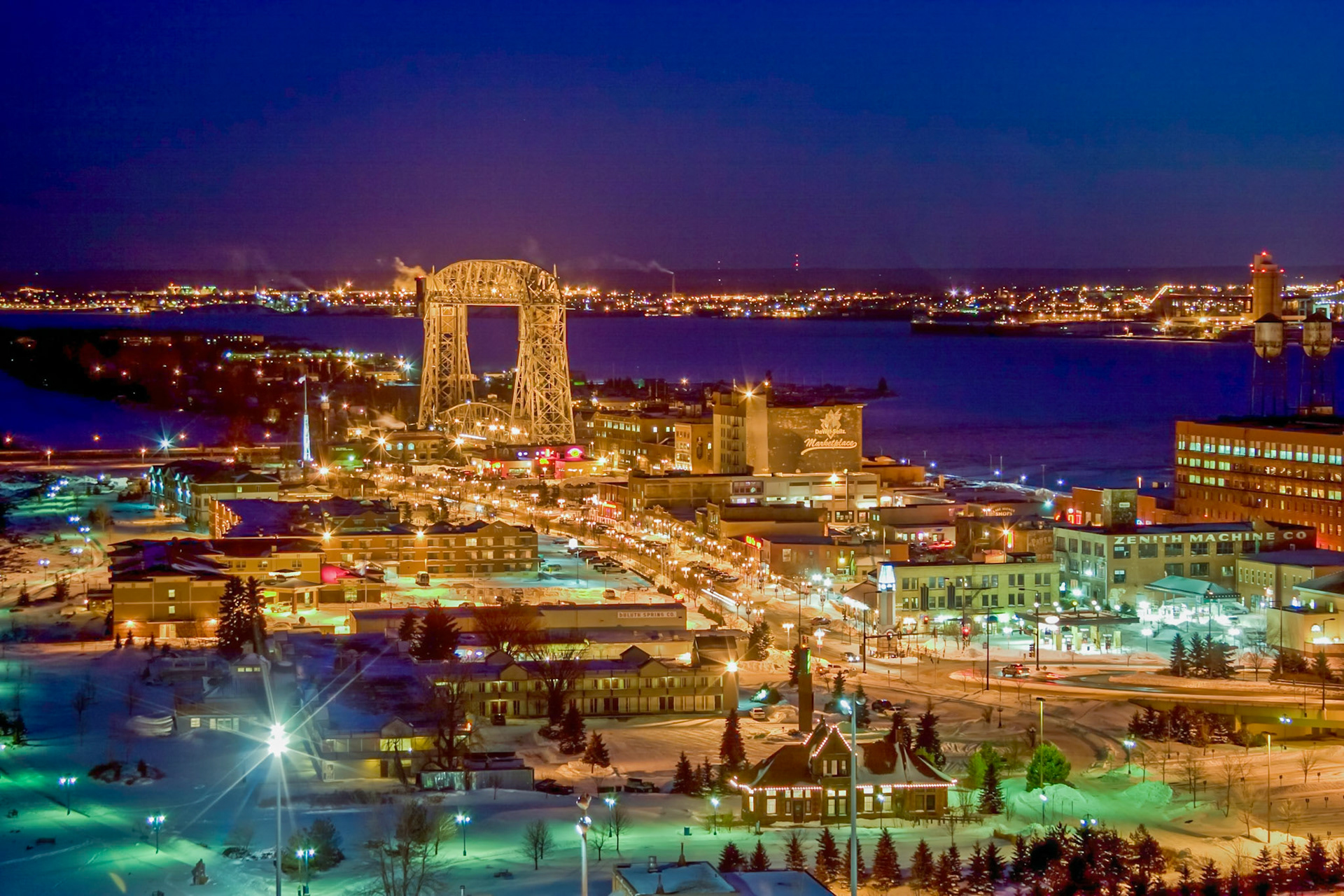 January 27 - Winter CityWinter nights bring a different kind of beauty to Duluth, one of the sparkling lights, tinted snow cover, and muffled sounds of a sleepy town.Duluth has a reputation for cold winters, and it is the very cold that brings out the attraction of this "Winter City."“Glory to God in the highest, and on earth peace among those with whom he is pleased!” Luke 2:14Thank you, Lord, for your care for us by providing resources to live here and enjoy the cold of winter and the warmth of summer.