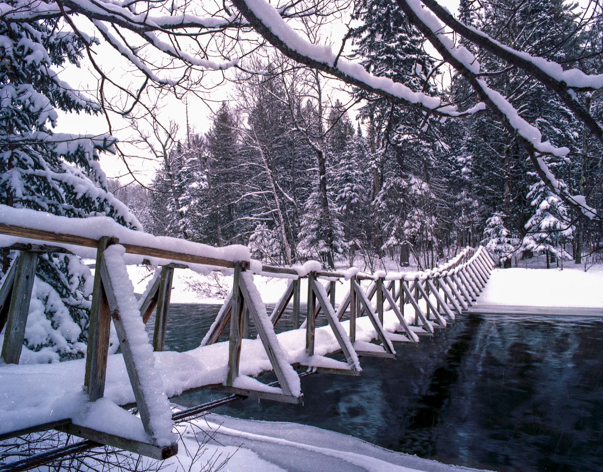 April 22—Springtime on the Brule.  Springtime on the Brule River is often snow-covered.  A visit to the Brule in April is a fantastic way to experience the peaceful forest and quiet whipper of spring runoff. Despite the snow-covered surroundings, the Brule River is a popular destination for fishing enthusiasts during the spring months.  The river is home to various fish species, including steelhead, brown trout, and brook trout, and the spring season provides an excellent opportunity to catch them. "Whoever believes in me, as Scripture has said, rivers of living water will flow from within them." - John 7:38The peaceful influence of snowfall during springtime in the Northland is like a healing tonic for the soul, a divine gift from our heavenly creator.