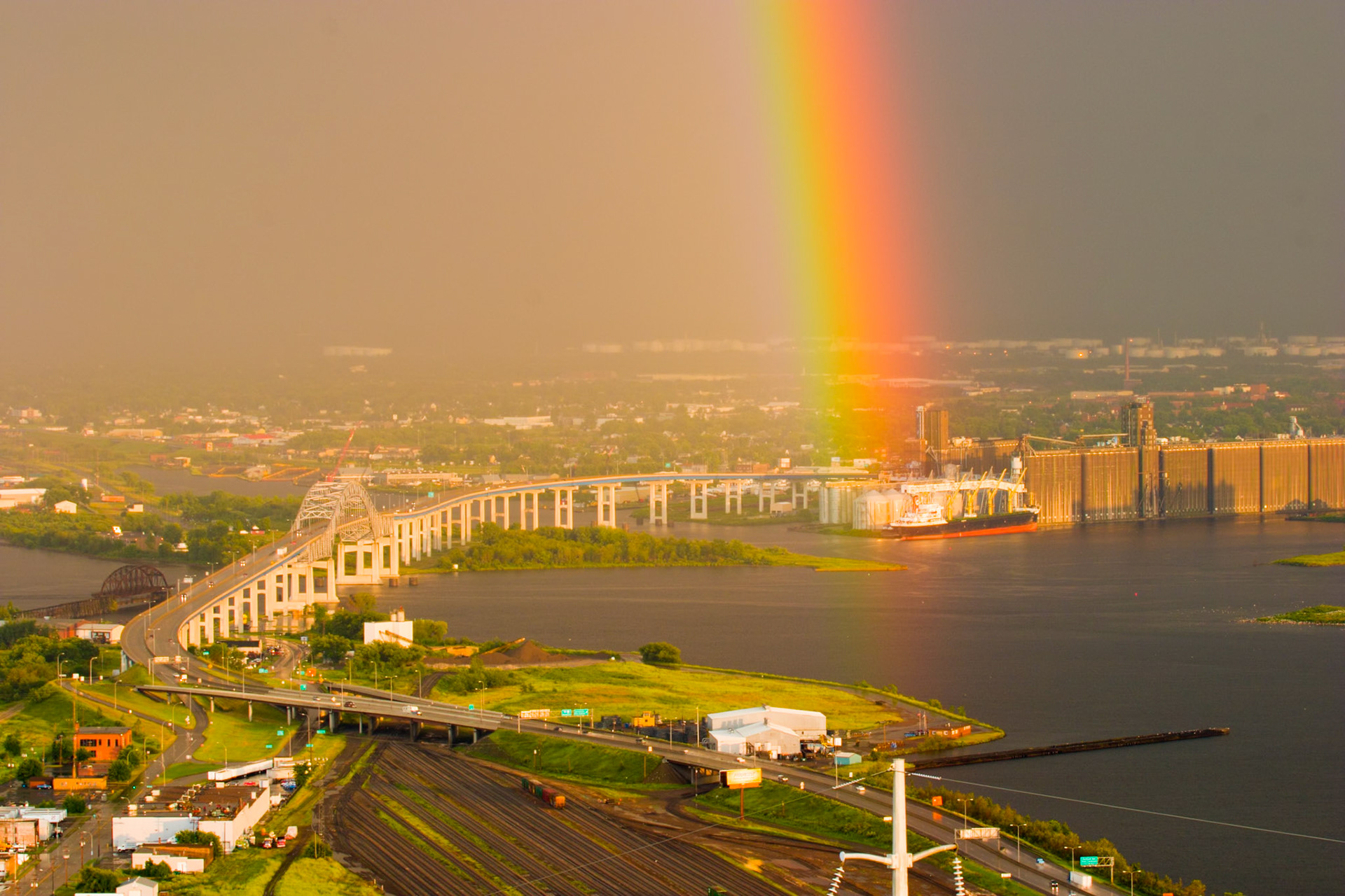 A rainbow highlights a ship loading grain in Superior Wisconsin.