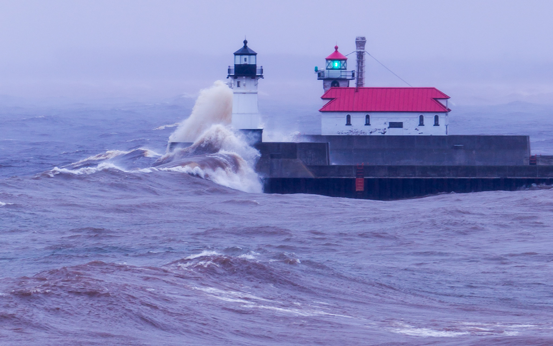 April 25 - Surf's Up! An April Noreaster stirs Lake Superior into a mighty display of wind and waves. The waves exert tons of pressure on these historic lighthouses that have stood the test of Lake Superior for over 100 years."For since the creation of the world God's invisible qualities—his eternal power and divine nature—have been seen, being understood from what has been made, so that people are without excuse." - Romans 1:20It is not hard to see God's powerful hand in everything around us, especially in the storms.