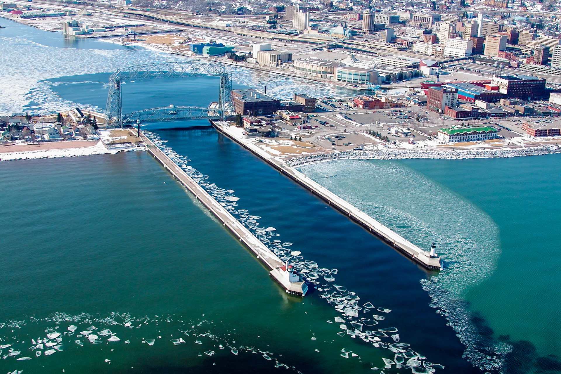The Duluth Aerial Lift Bridge, built in 1905 was originally a transfer bridge using a gondola type carriage to move cars, people, and horses between Park Point and Downtown Duluth.
