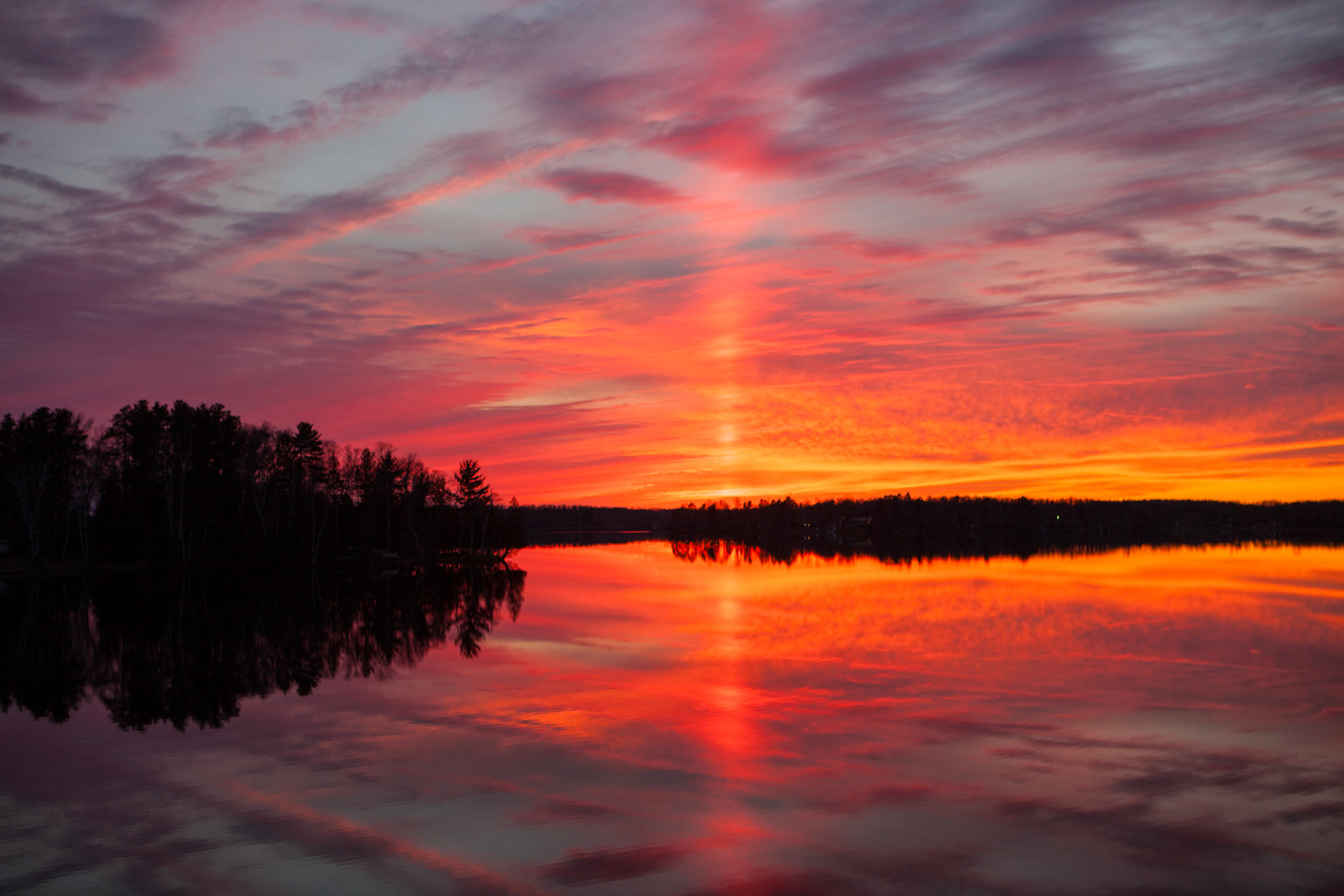 November 14 - Sun Pillar SunsetIce crystals in the atmosphere create a pillar of light to magnify the mid-November sunset.Sun pillars, caused by ice particles in the atmosphere, are beams of light that extend vertically upward from the sun when conditions are right and the sun is on the horizon.Witnessing a sun pillar at sunset is a truly breathtaking experience that reminds us of the wonder and beauty of God's creation.From the sun's rising to its setting, the name of the Lord is to be praised! Psalm 113:3