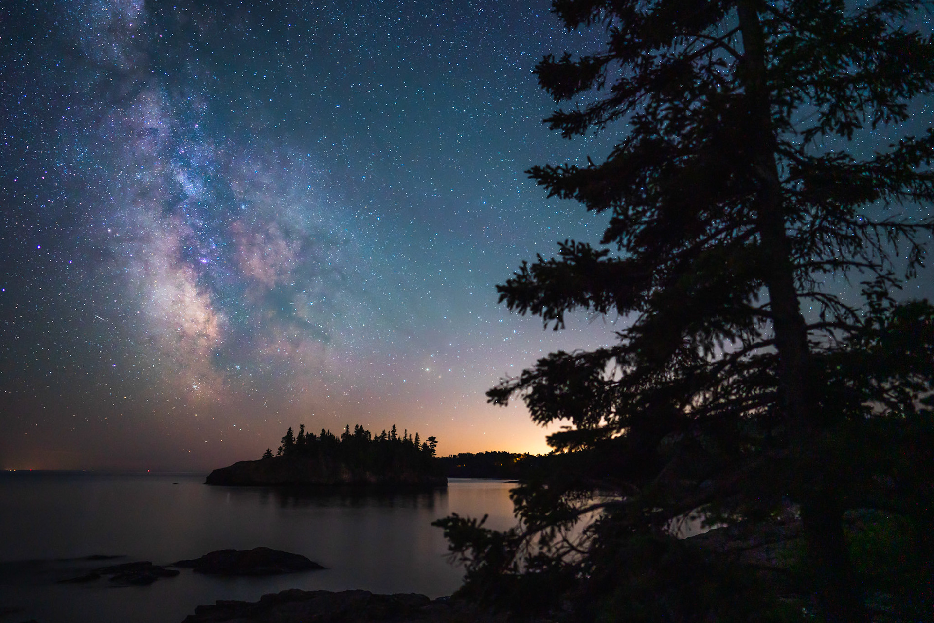 August 15 - Silent Night - The Milky Way slowly drifts across the night sky as the seasonal clock ticks forward.The Milky Way, a colossal expanse spanning about 100,000 light-years, is a testament to the grandeur of God's creation, designed to inspire awe and wonder. "The heavens declare the glory of God, and the firmament showeth his handiwork. Day unto day uttereth speech, and night unto night showeth knowledge." Psalm 19:1