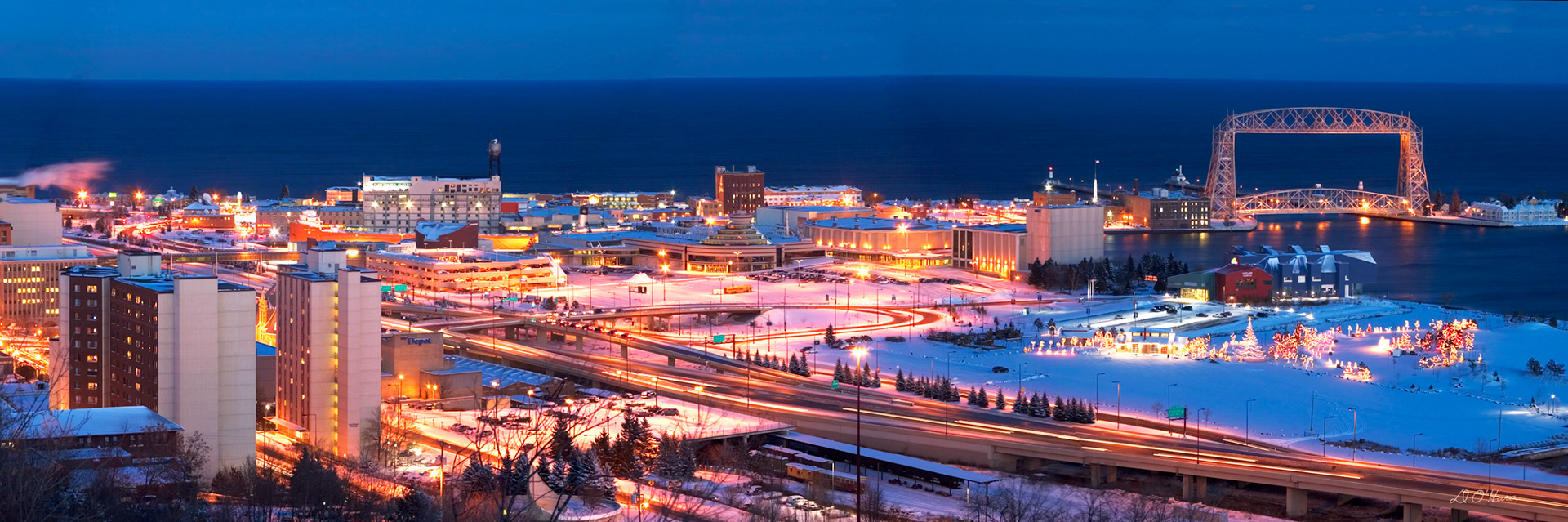A soft blanket of snow and the fading light of a winter twilight brings a calming glow to Duluth. This image is a composition of 5 separate images digitally stitched together.