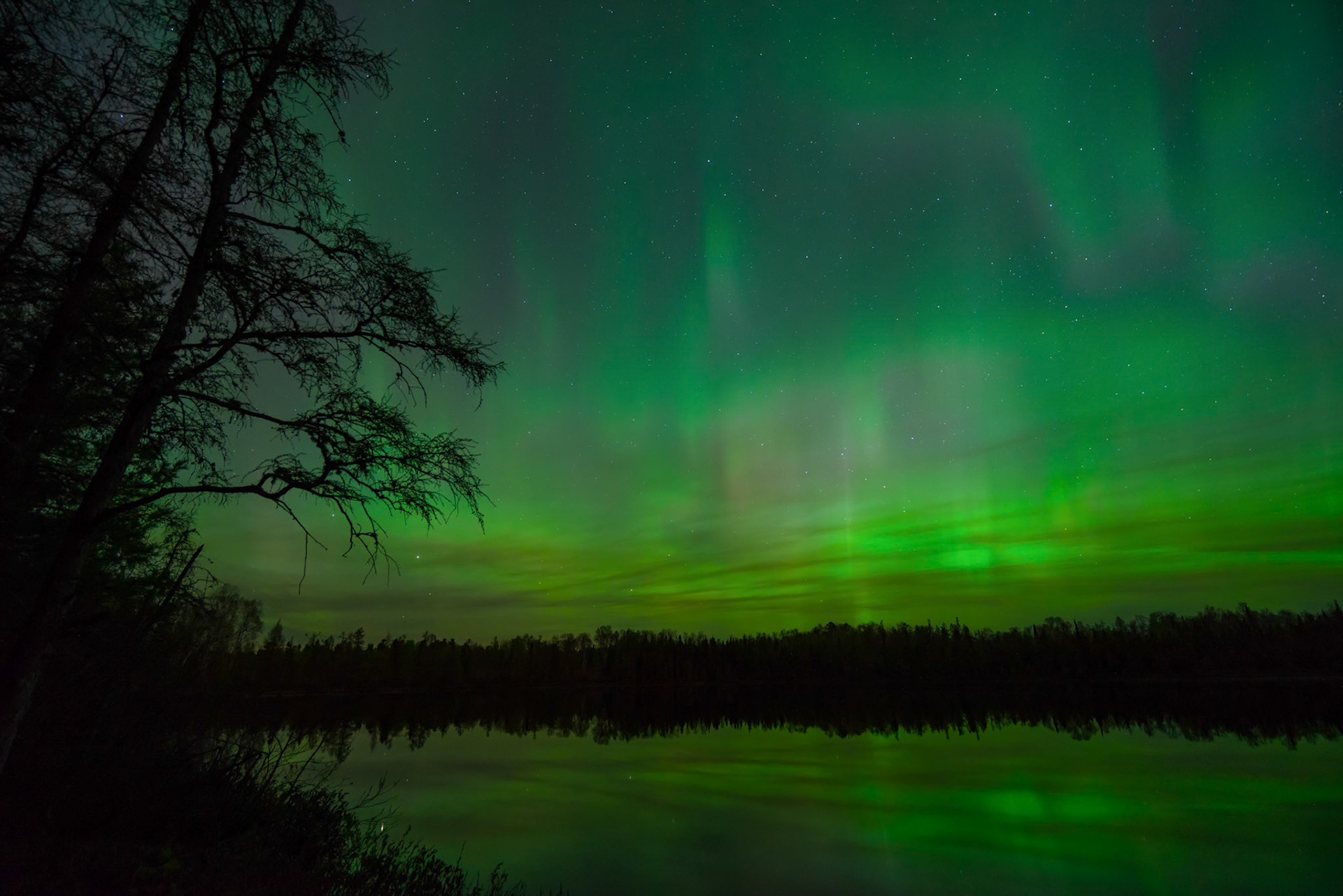 A passing solar storm triggered the Northern Lights into a midnight light show.