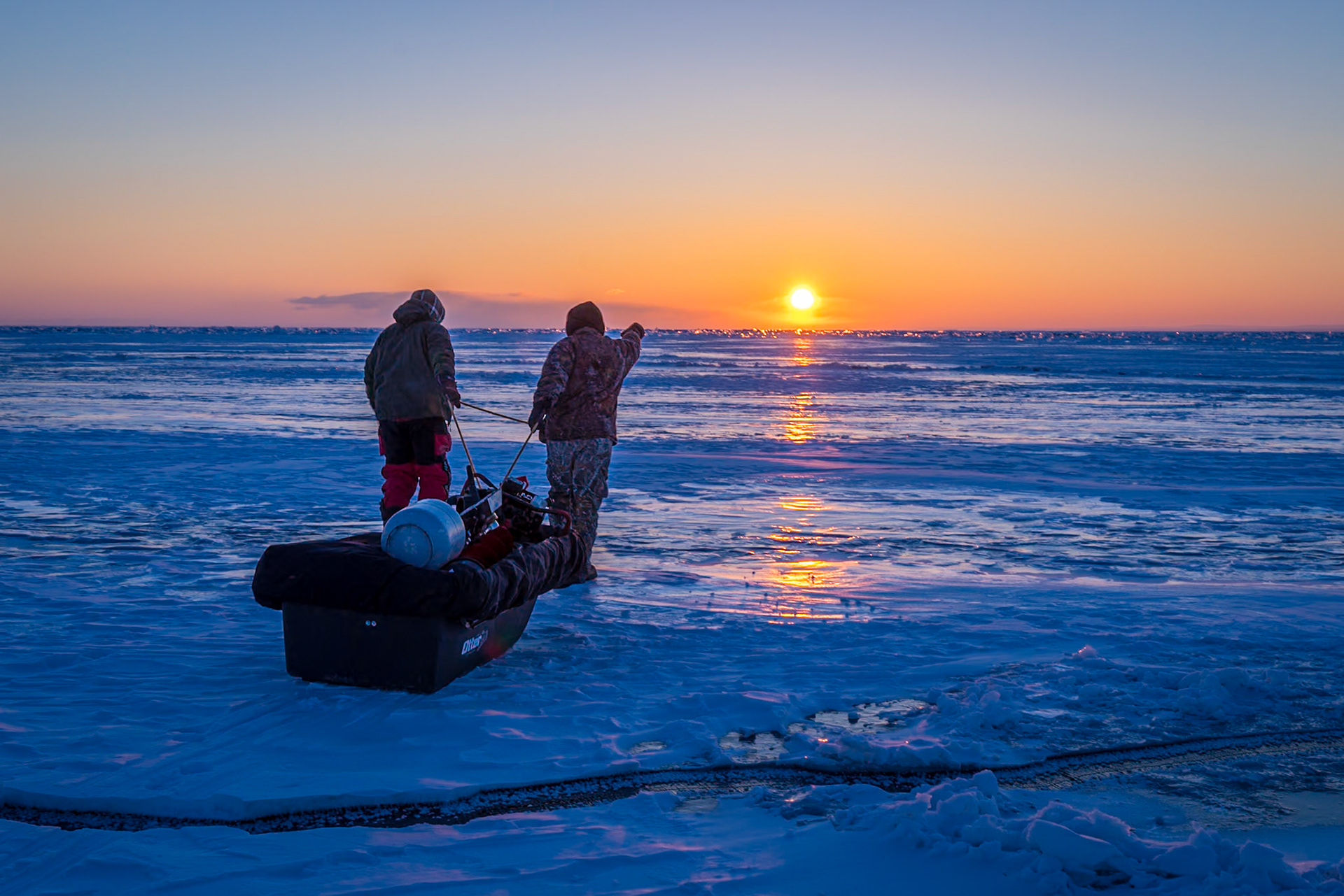 February 19 — Early Morning Ice FishingAs the sun crested the horizon, two anglers stepped onto the frozen expanse of Lake Superior, pulling their sleds out onto the ice field and seizing the opportunity. The lake shimmered with cold blue tones, reflecting the quiet beauty of a winter morning just beginning to wake.The temperature hovered near -20°F as they set out — cold enough to lock the ice in place and provide solid footing, at least for the moment. Still, every trip carries risk. Wind and shifting ice packs can change conditions quickly, reminding those who venture out that Lake Superior commands both respect and humility.While these fishermen hoped for a successful catch, the true rewards reached far beyond fish alone. Fellowship, conversation, shared effort, fresh air, and the simple joy of being present on the ice formed the heart of the experience. Moments like these build memories that linger long after the gear is packed away."Let me hear in the morning of your steadfast love, for in you I trust. Make me know the way I should go, for to you I lift up my soul." — Psalm 143:8Hope takes many forms on mornings like this — steady ice, calm weather, a tug on the line. Yet above all, our lasting hope is found in Jesus Christ, who offers peace, direction, and promise not only for today, but for every tomorrow.
