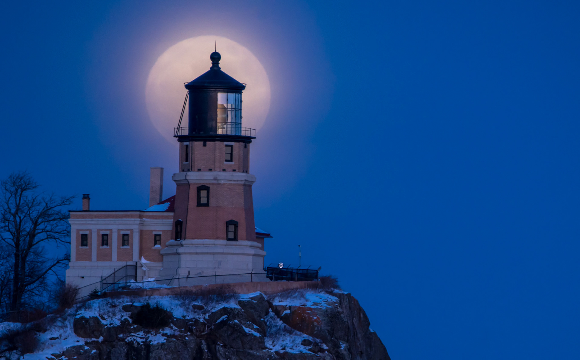 January 1 - January Full Moon behind Split Rock LighthouseFor the past 25 years, I have been trekking up the North Shore of Lake Superior to photograph the January full moon as it rises behind the rock cliffs, silhouetting the lighthouse. There are only a few winter nights when this can happen, and it's a notable night that photographers in the northland wait for.As you stand there and watch this phenomenon, you cannot help but appreciate the universe as it rotates from days to months, seasons, and years. The clockwork of the universe keeps ticking.Our heavenly Father not only created the heavens, but He also sustains them for His joy and our pleasure.Everything He does reveals His glory and majesty. His righteousness never fails. Psa 111:3Look up into the clear, starry winter night, and it will make you feel small and our God very big.