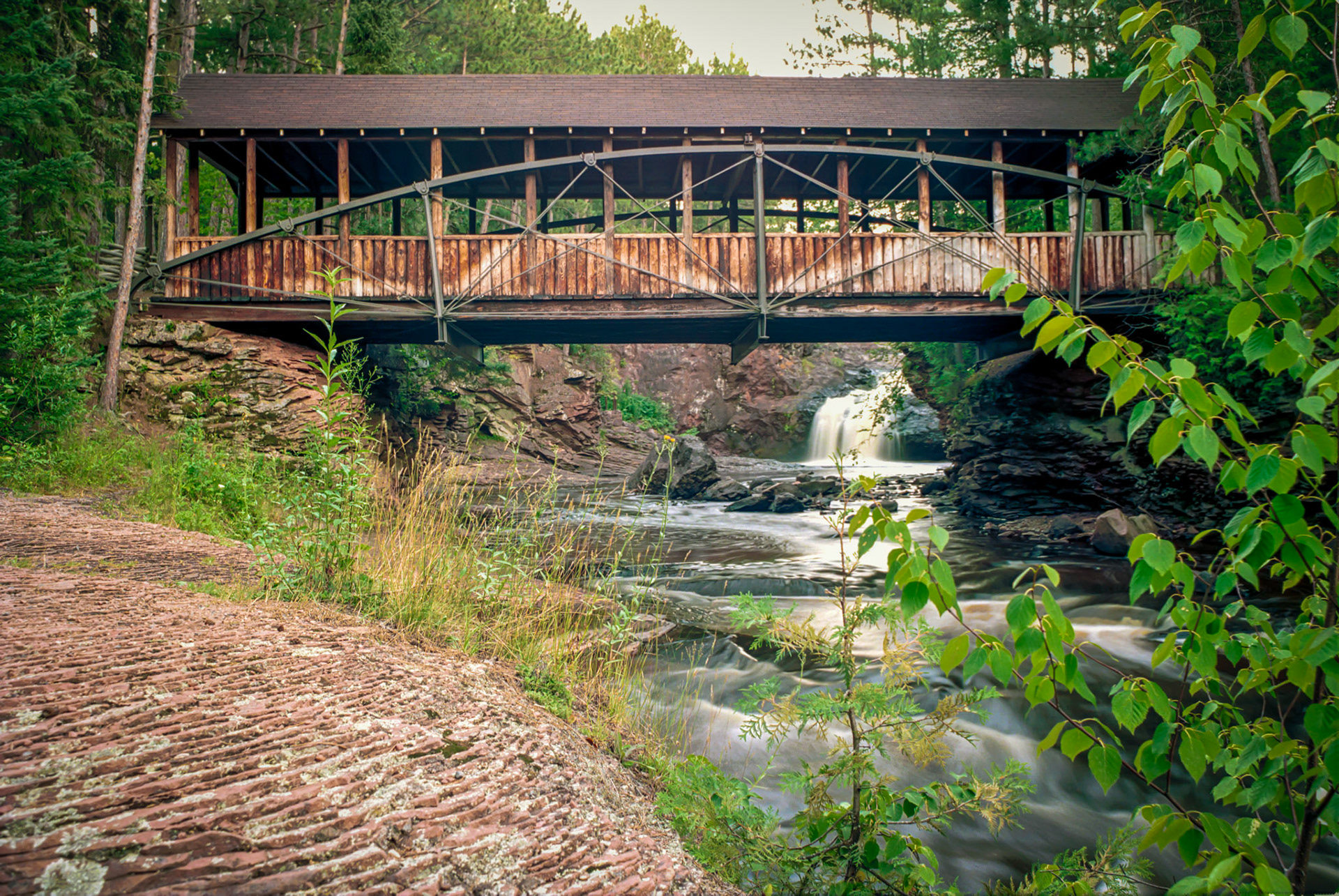 Sept 4 - Bowstring Bridge - The Bowstring Bridge across the Amnicon River graces the beauty of this beautiful park located near Superior, Wisconsin. Deep calls to deep at the roar of your waterfalls; all your breakers and your waves have gone over me. Psalm 42:7