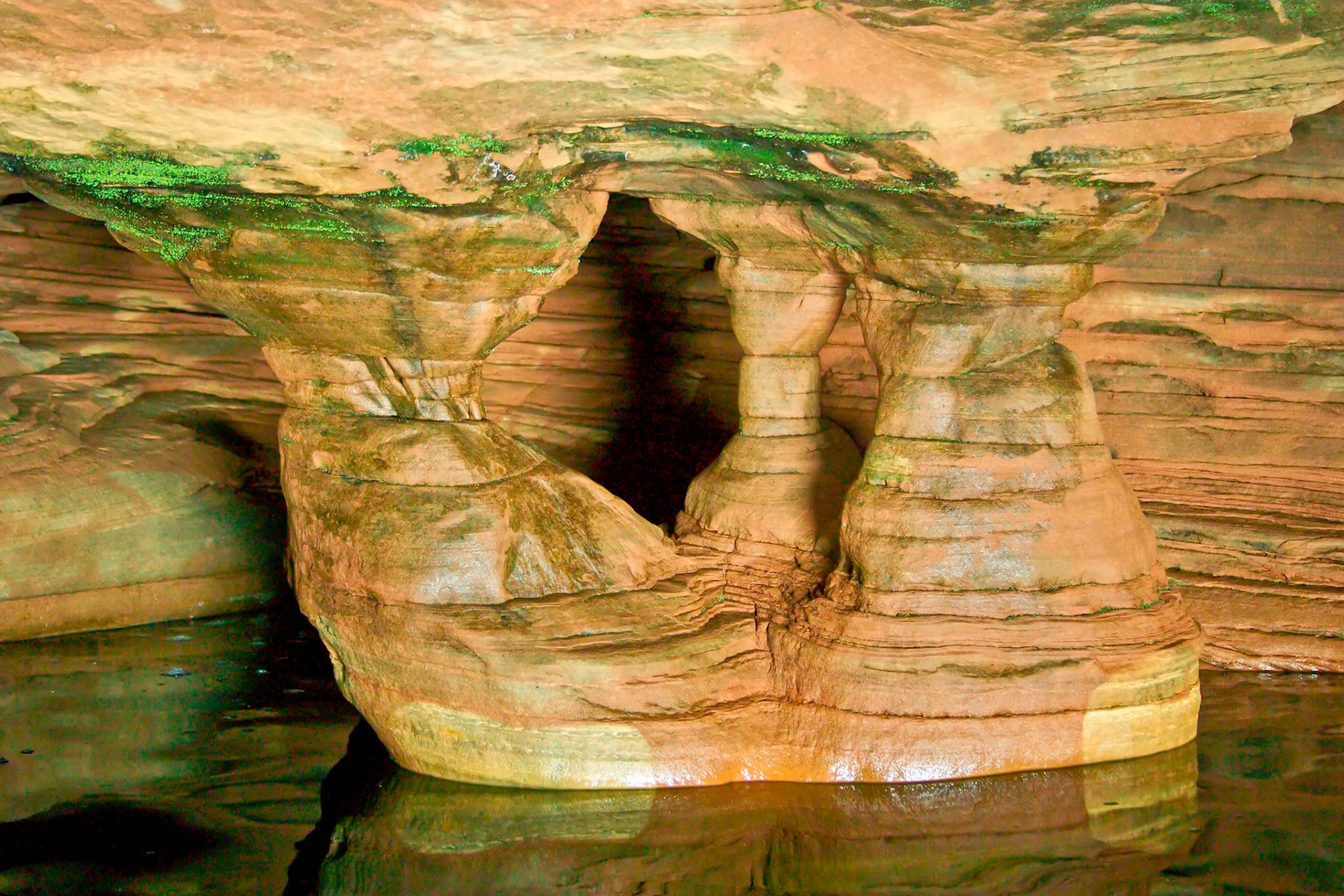 The Apostle Islands sit just off shore from the Bayfield Peninsula on Lake Superior. Erosion of the sandstone has carved out sea caves which can be visited by boat during the summer, and on skies during colder winters. The caves are one of the wonders of the region and give new meaning to "Heaven on Earth".