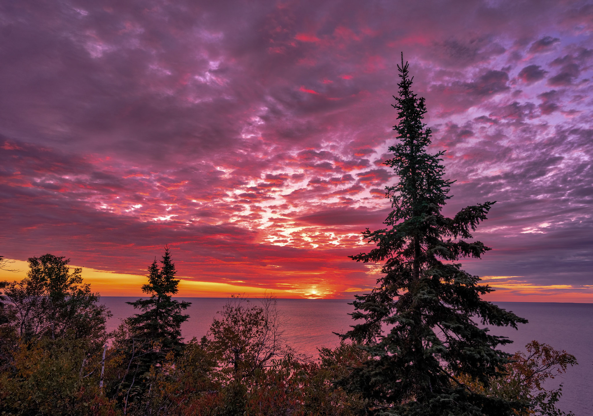 The first light of morning breaks over Lake Superior as the clouds caught the light for a brief moment before hiding the sun once again.
