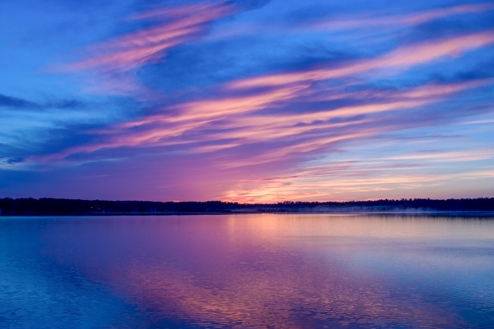 A quiet sunset on Caribou Lake fills the sky with a multi-colored display of God's beauty.