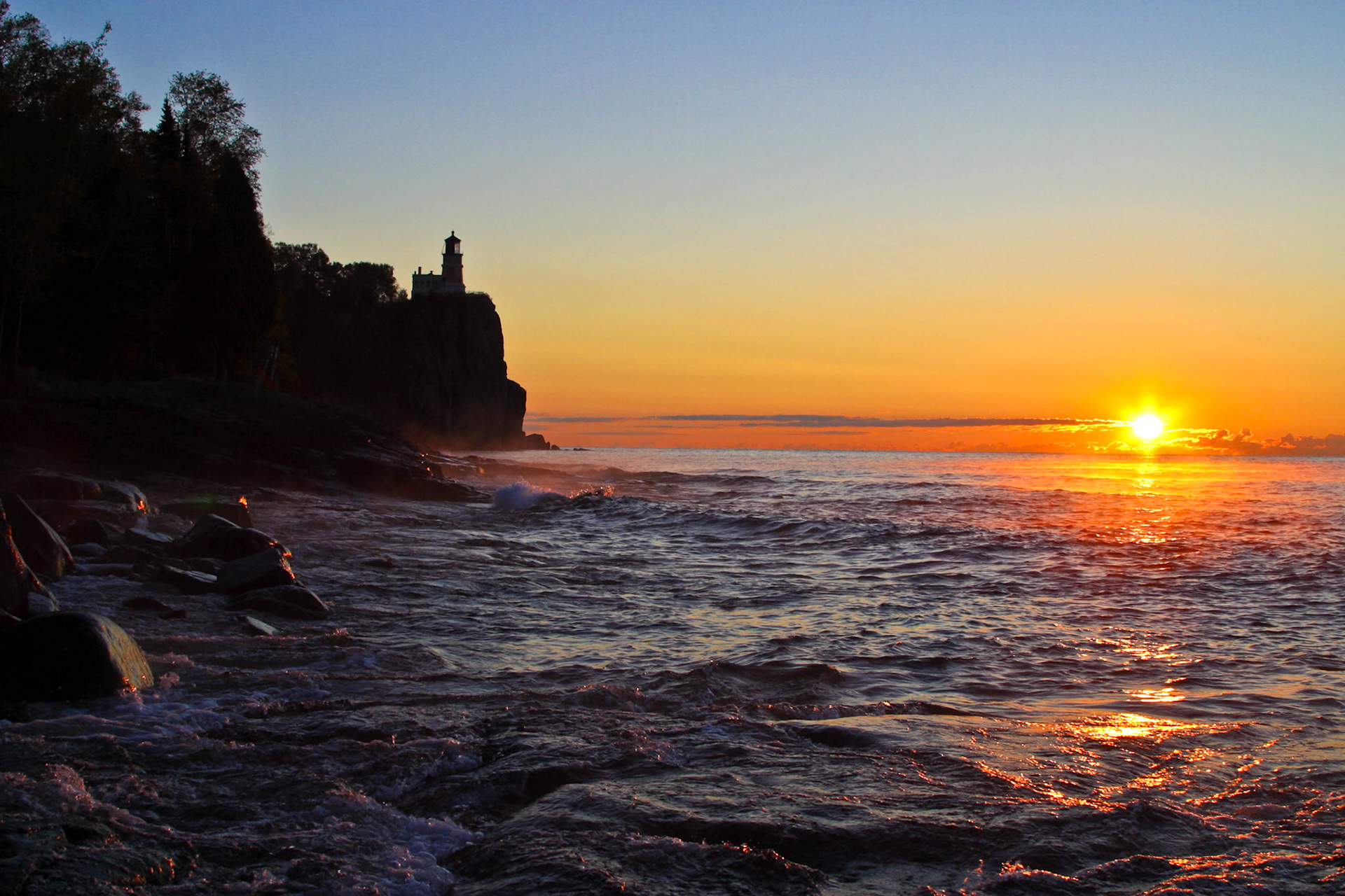 Early October brings cool temperatures and clear skies to the Lake Superior Region. On this October morning, Split Rock Lighthouse stood sentinal over the rising sun.