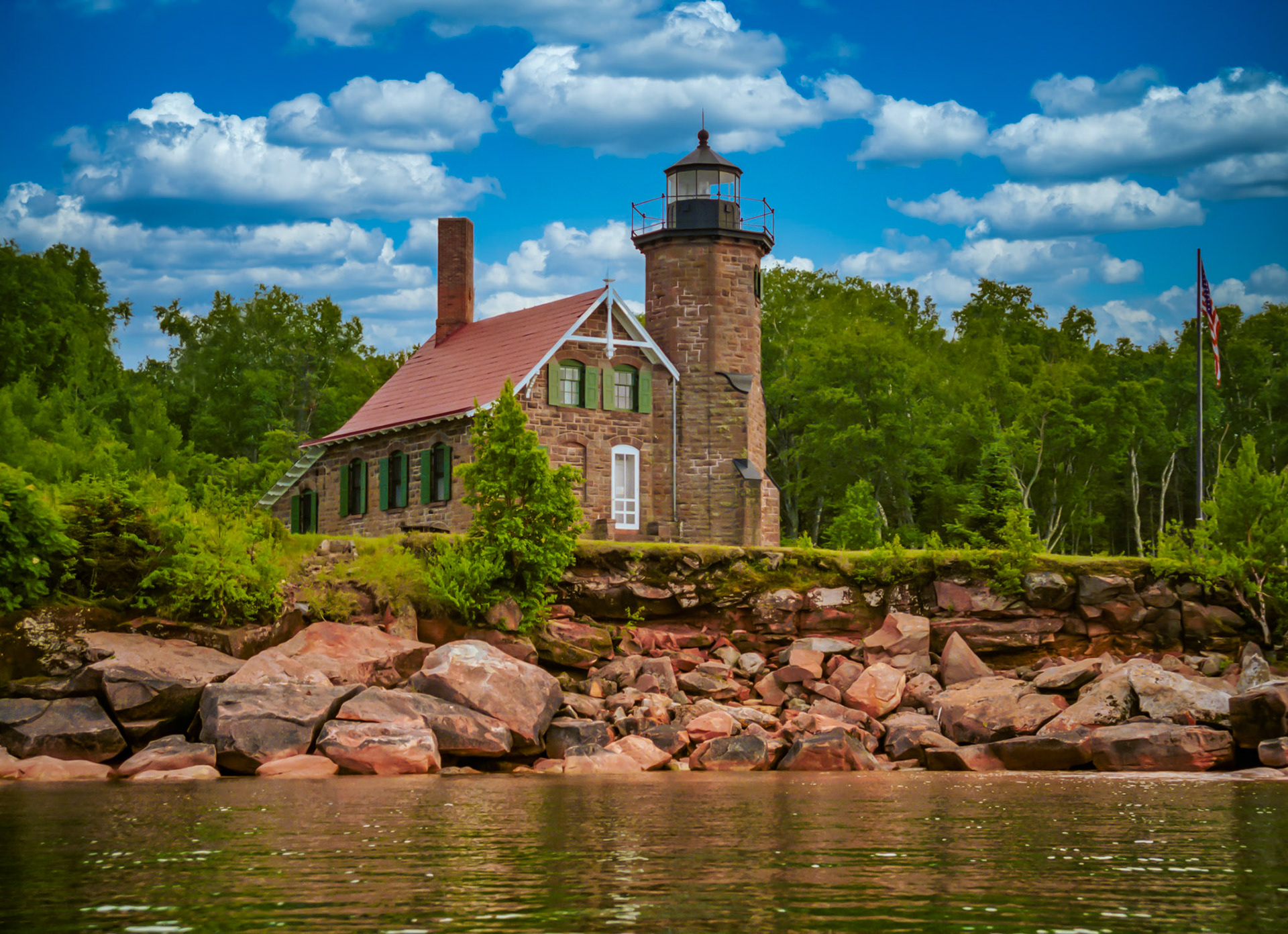 August 22-Sand Island LighthouseThe Sand Island Lighthouse, a striking structure near the western end of the Apostle Islands, was built in 1881. This charming lighthouse, made from sandstone quarried on-site, is not just a beautiful landmark on Lake Superior, but also a crucial guide for ships navigating the treacherous waters. It stands as a testament to the architectural and engineering marvels of its time."The light shines in the darkness, and the darkness has not overcome it." - John 1:5 The lighthouse keepers were diligent about keeping the light lit at night. So is our God diligent about the light of salvation