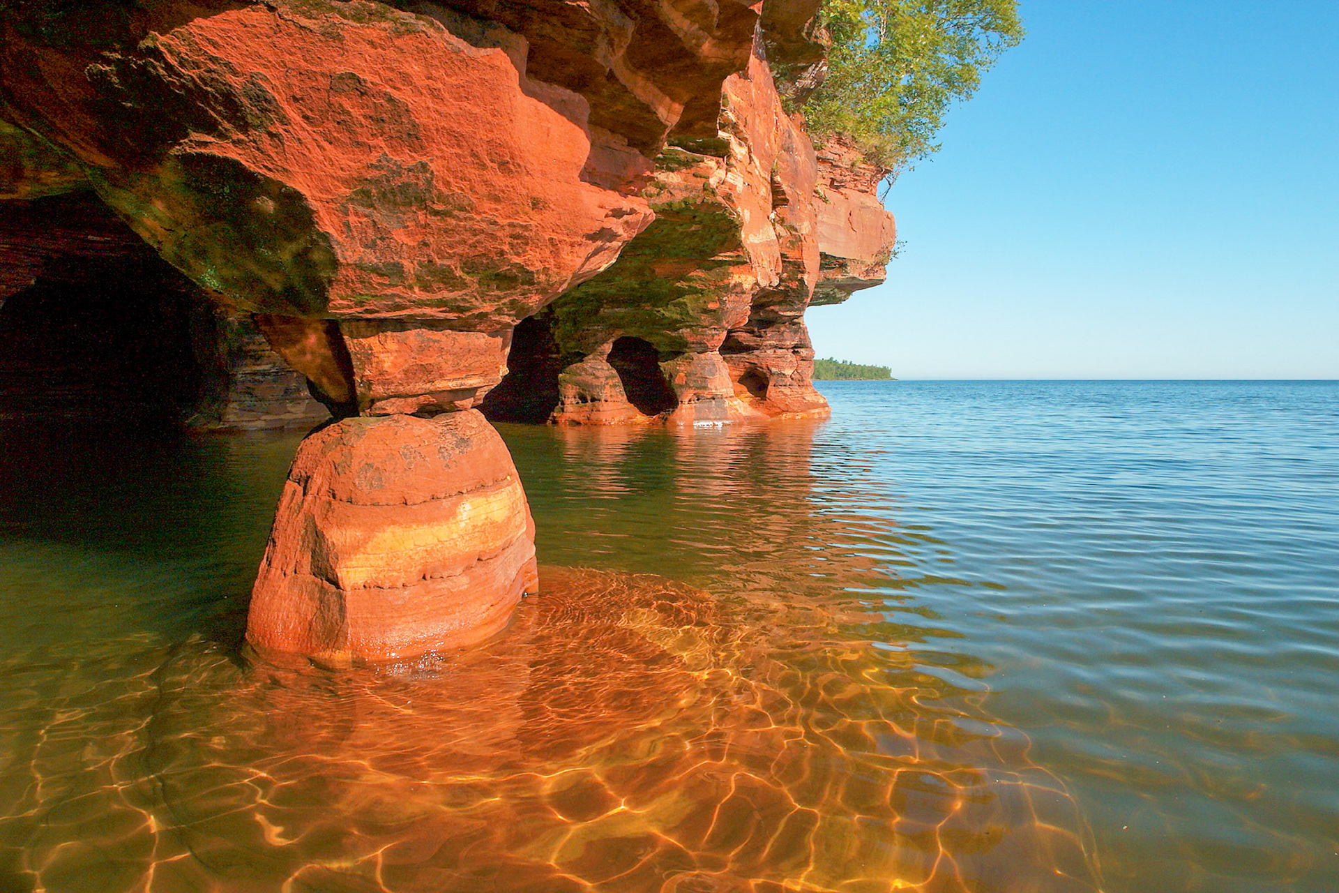 May 10th - The Apostle Islands sit just off shore from the Bayfield Peninsula on Lake Superior. Erosion of the sandstone has carved out sea caves which can be visited by boat during the summer, and on skies during colder winters. The caves are one of the wonders of the region and give new meaning to "Heaven on Earth".