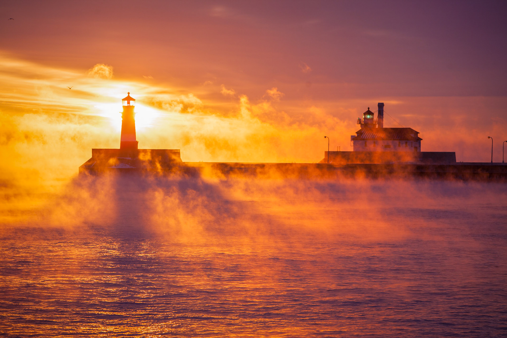 December 7 - Lighthouse SilhouetteDecember brings official meteorological winter and powerful Canadian cold fronts. The frigid lifts water vapor off the surface of Lake Superior, creating steam called sea smoke.Sea Smoke is a beautiful weather phenomenon that draws the viewer to the big lake's open water to watch this surreal event.Yet you do not know what tomorrow will bring. What is your life? For you are a mist that appears for a little time and then vanishes. James 4:14