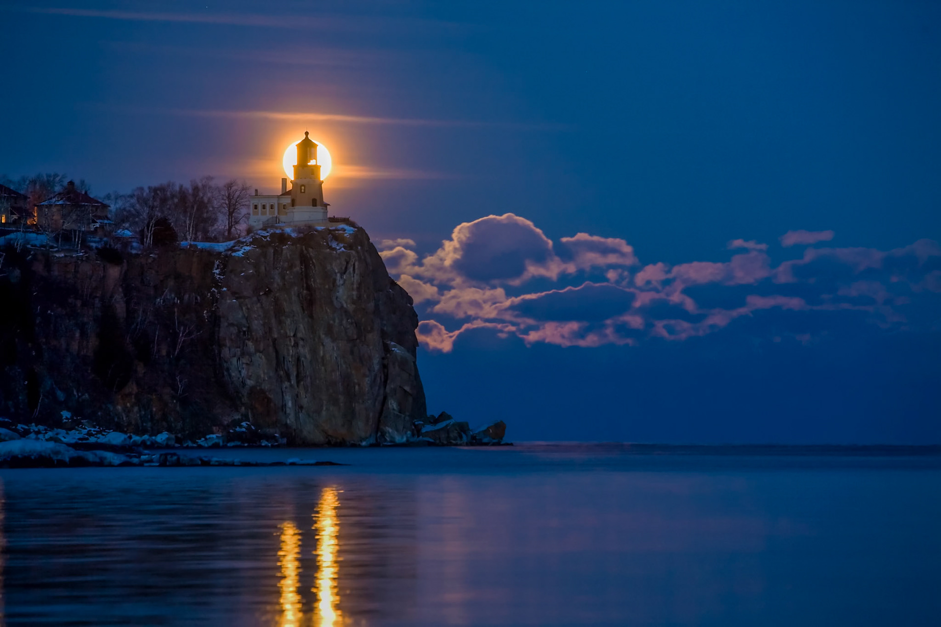 January 22 - Split Rock SilhouetteThe rising moon's light backlights the Split Rock Lighthouse and highlights the scattered clouds, producing a stunning winter scene.One night out of the year, the moon rises in the perfect location and creeps up the cliff's backside, suddenly appearing behind the lighthouse, filling its role in the universal clockwork of God's creation.The LORD is my rock, fortress, and savior; my God is my rock, in whom I find protection. He is my shield, the power that saves me, and my place of safety. Psa 18:2Thank you, Lord, for creating the conditions to highlight the North Shore on a cold winter night and glorify you in the world and heavens.