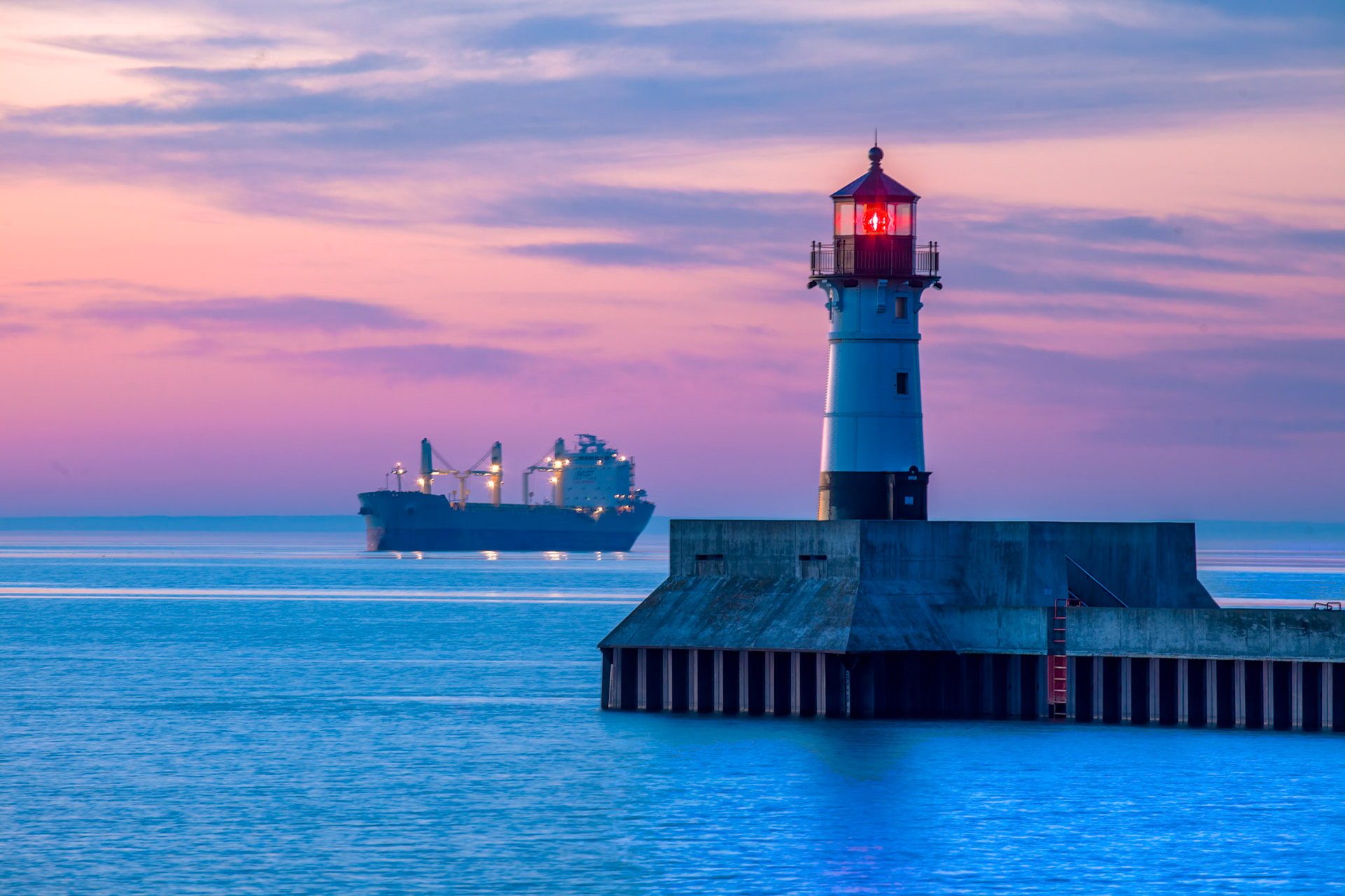 June 12—The Anchorage—An ocean freighter, poised at anchorage on Lake Superior, awaits its turn to embark on a journey of loading grain in Duluth. The early morning light, a blend of magentas and blues, adds a touch of anticipation to the scene.The soft first light of day and the calm lake set the scene, your soul at rest for a fresh start."The Lord is my shepherd; I lack nothing. He makes me lie down in green pastures, he leads me beside quiet waters, he refreshes my soul." - Psalm 23:1-3Fresh starts are an excellent way to set your course for the day ahead.