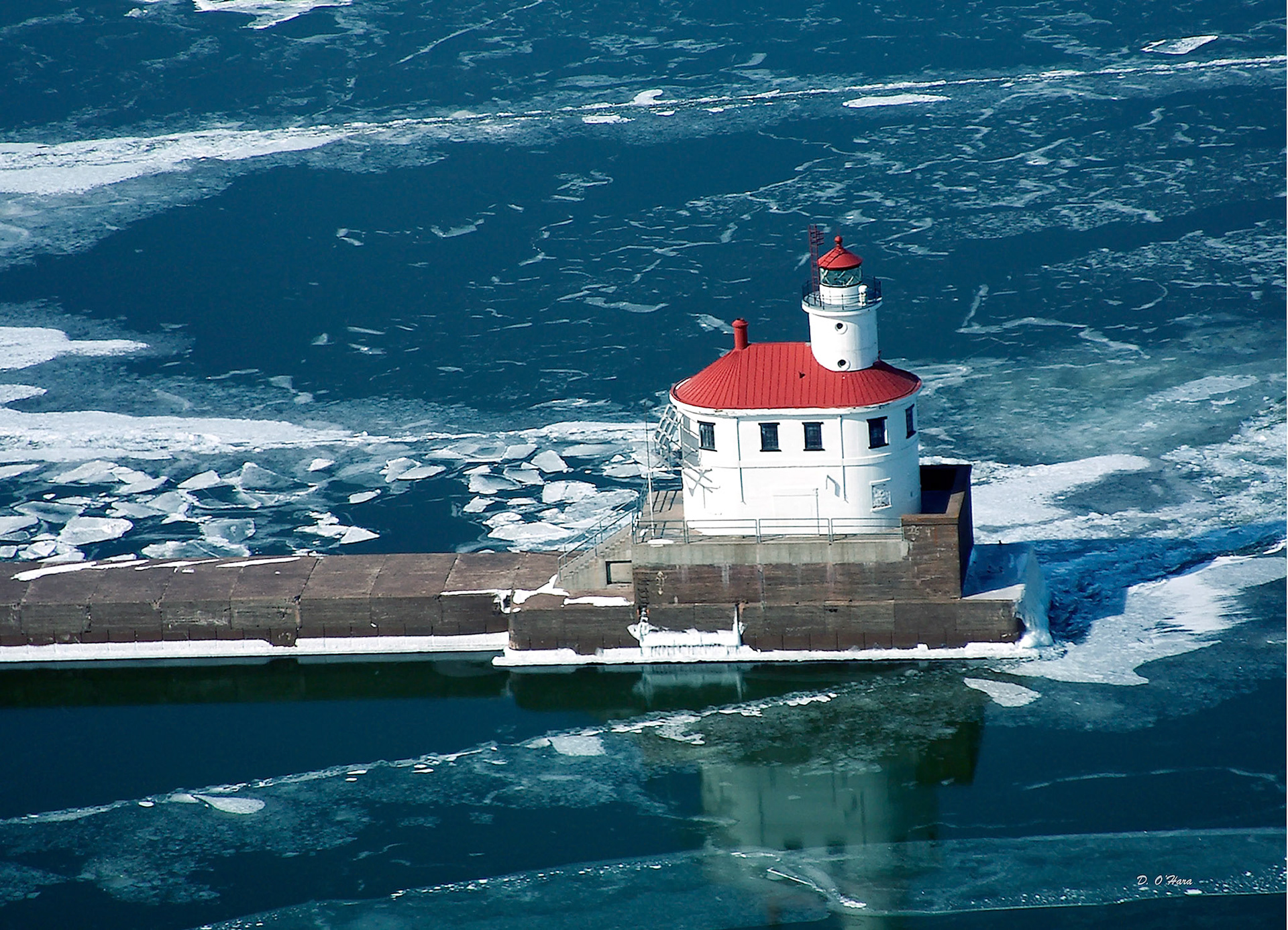 March 6 - Spring Breakup at Wisconsin PointThe aerial image of the Wisconsin Point Lighthouse shows that the ice on Lake Superior is rapidly breaking up by early March. The blue water is a welcome sight after a long winter in the Northland—a sure hope of the soon-arriving Springtime.For I know the plans I have for you,” declares the LORD, “plans to prosper you and not to harm you, plans to give you hope and a future. Jeremiah 29:11Soon, new life and fresh colors will begin to show throughout the landscape.